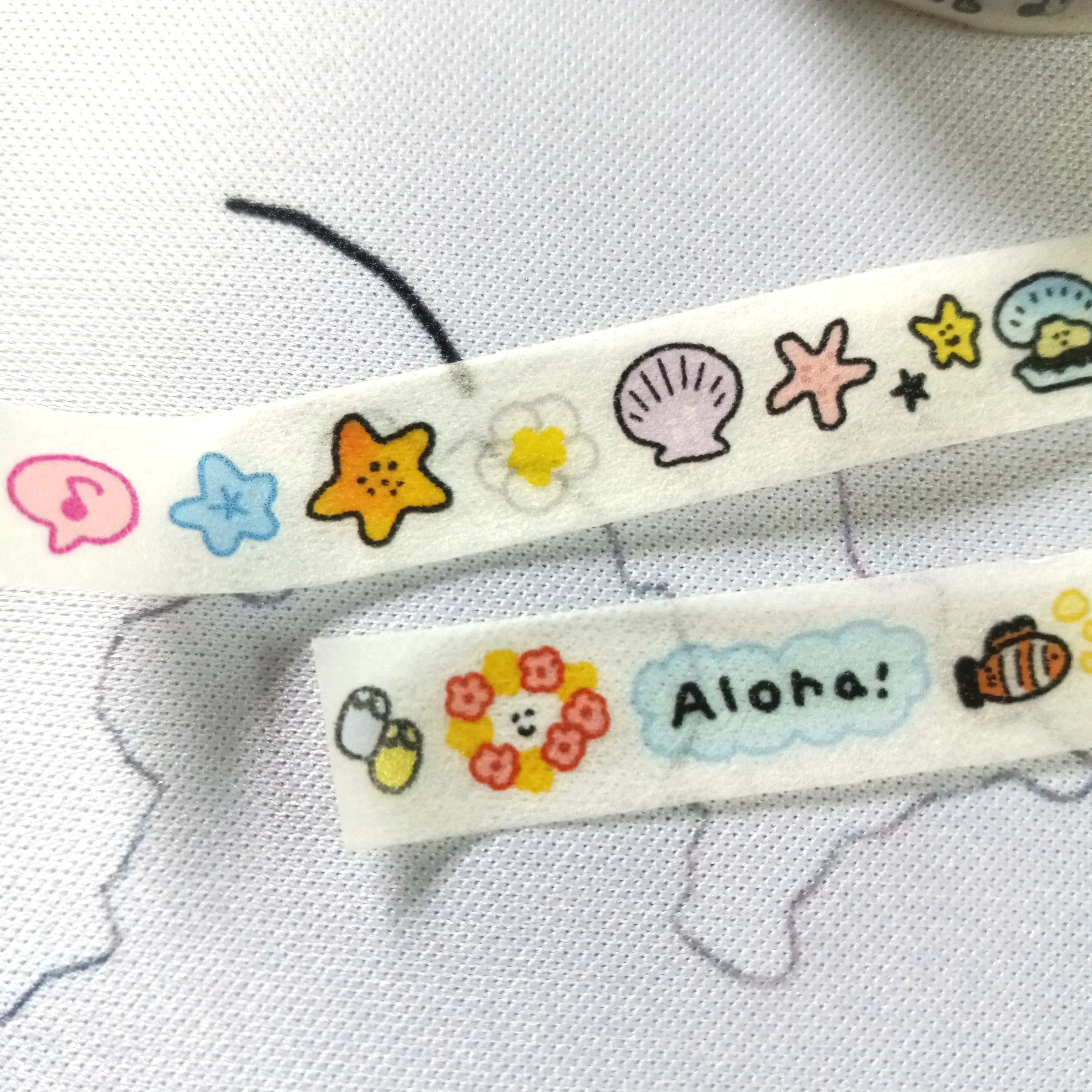 Aloha Hawaii mini washi tape roll with playful island-inspired illustrations for journaling and planner decoration
