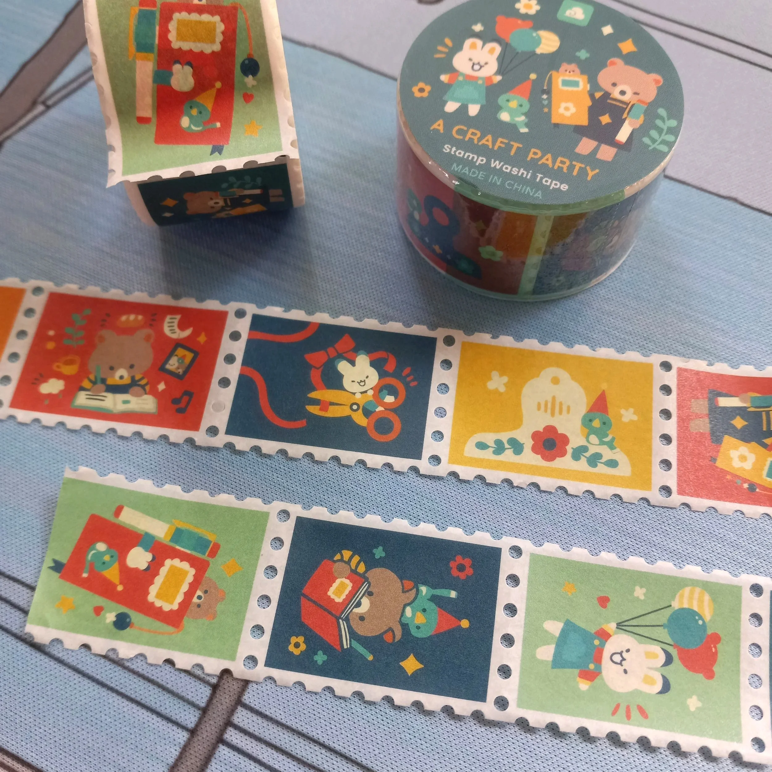 Detailed view of Thousand Skies stamp washi tape with repeating craft party themed illustrations for journaling and scrapbooking