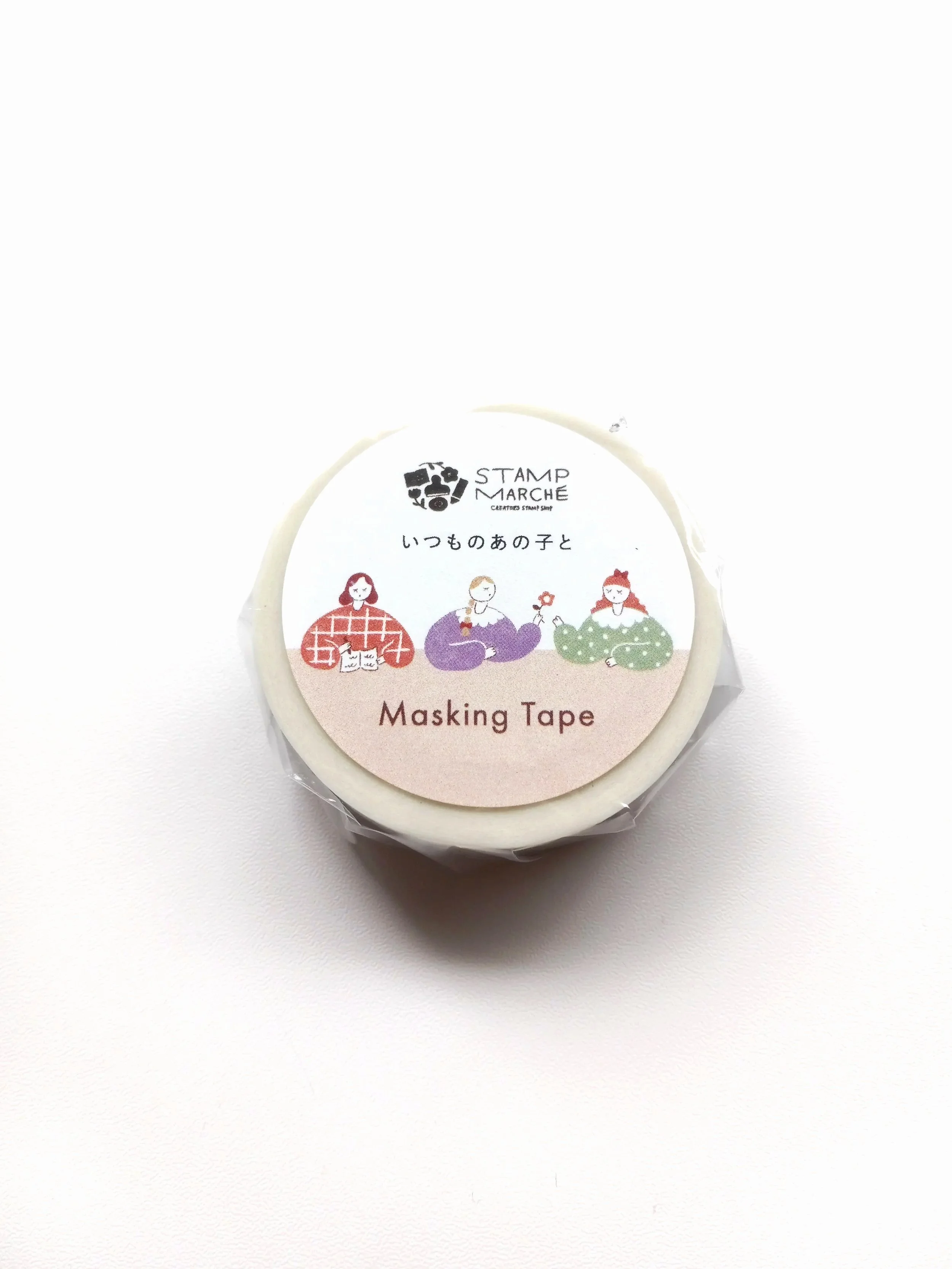 Close-up of Stamp Marche Friends washi tape featuring colorful girl illustrations and Japanese stationery design