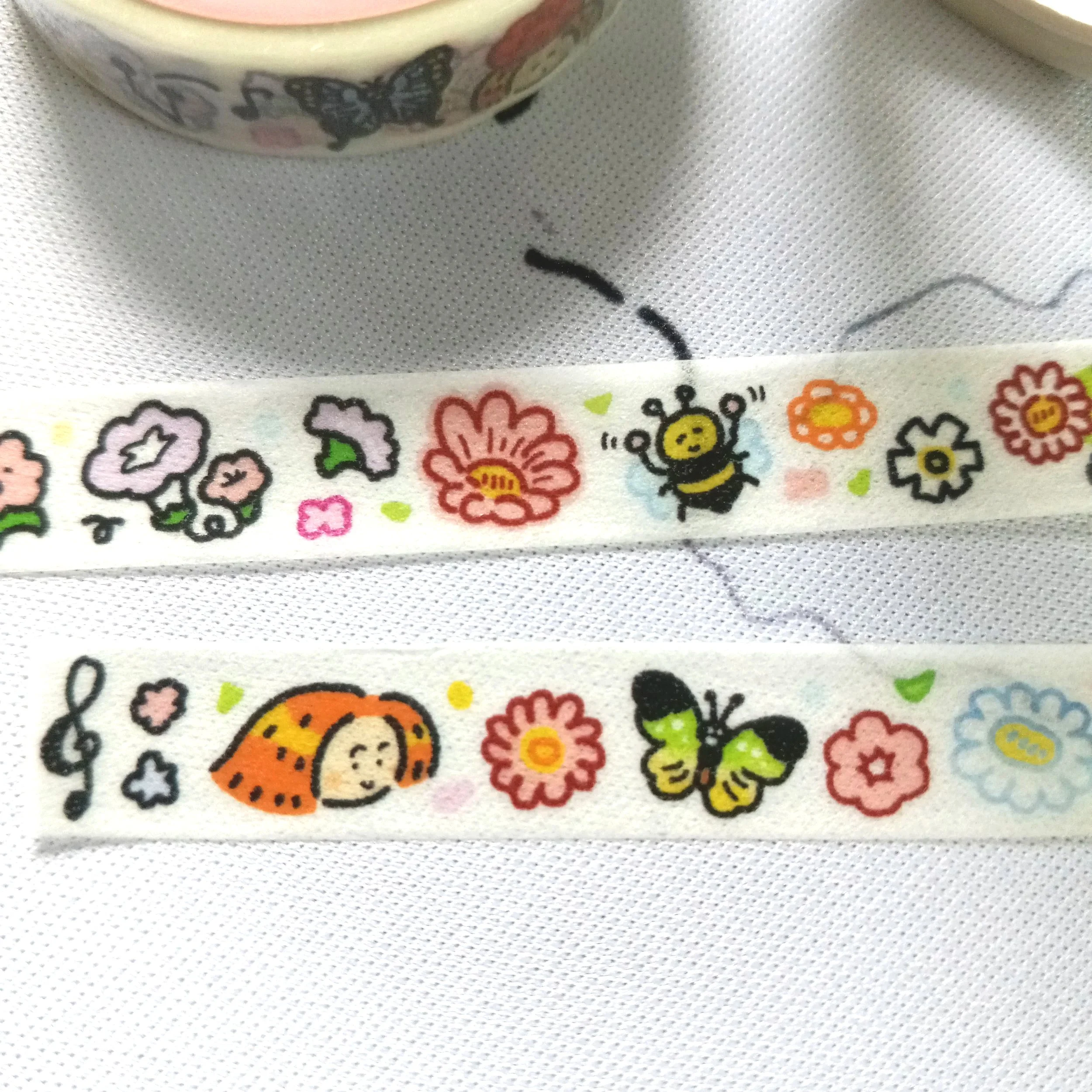 RiN! Studio mini washi tape showcasing vibrant, playful flower illustrations in a whimsical style