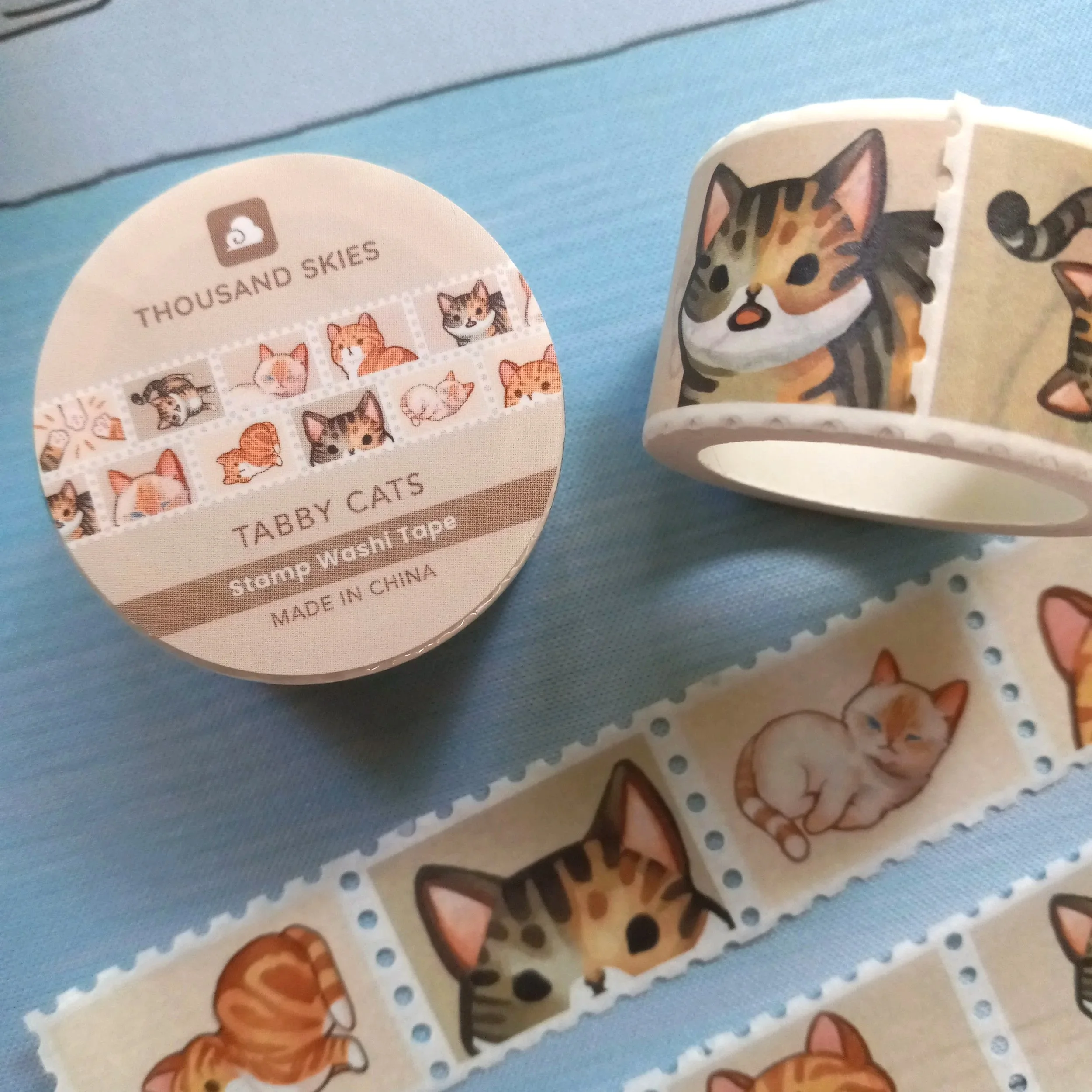 Stamp washi tape roll “Tabby Cats” by Thousand Skies featuring a repeating pattern of illustrated tabby cats on decorative tape