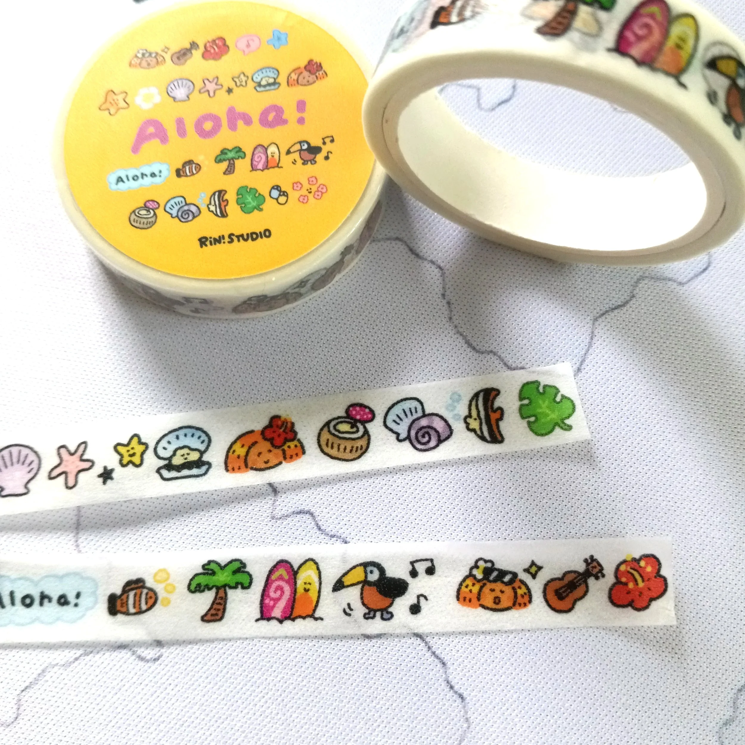 Tropical-themed mini washi tape featuring Hawaii-inspired designs, beach icons, and vibrant summer colors