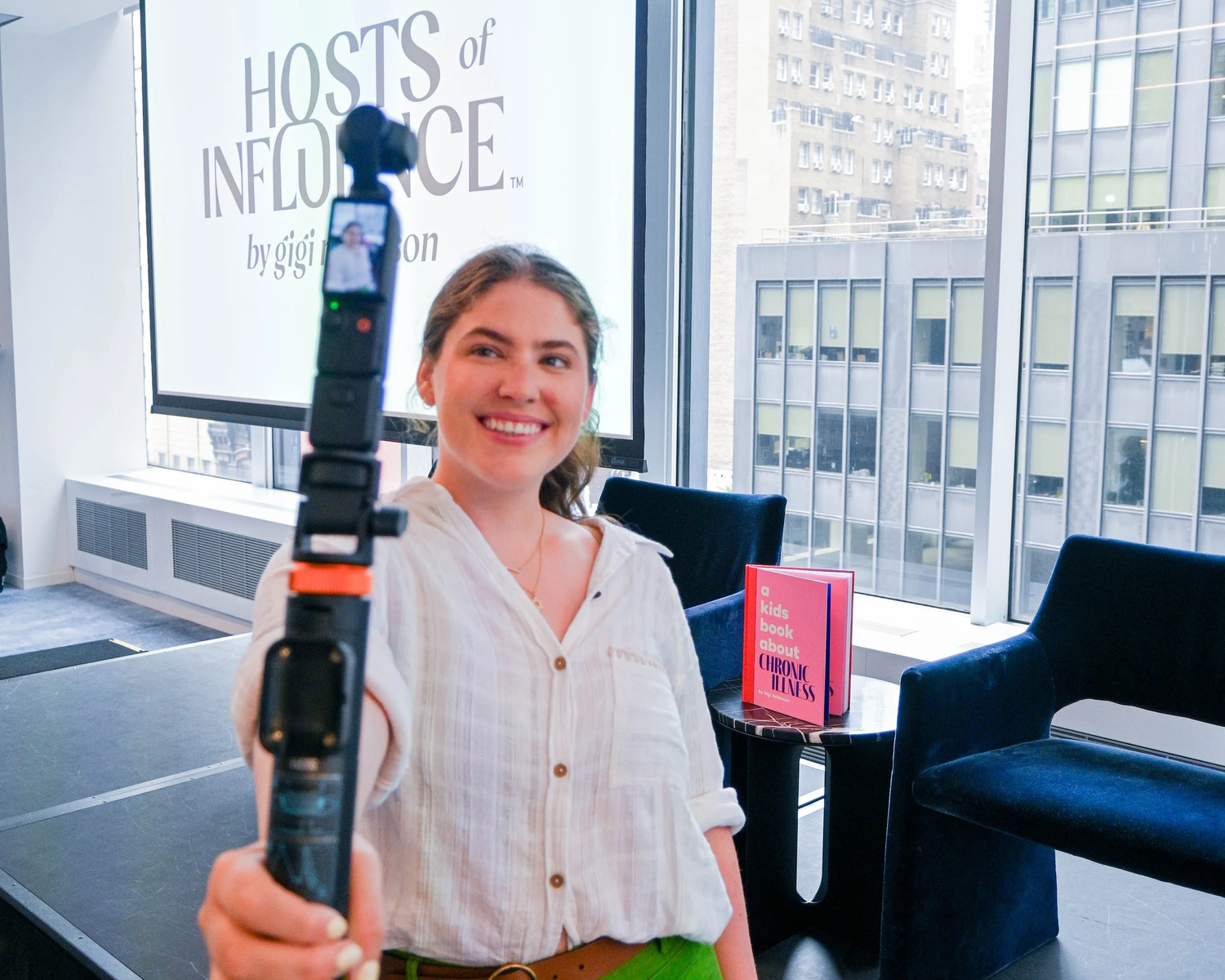 Gigi Robinson filming social content with a handheld camera