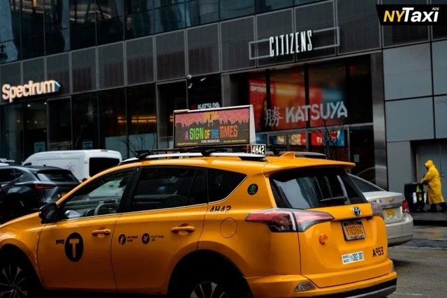 A printed taxi top advertising taxi top showing ASOT messange in NYC
