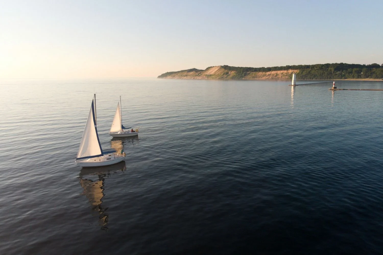 Sailboats near Frankfort Light on Lake Michigan