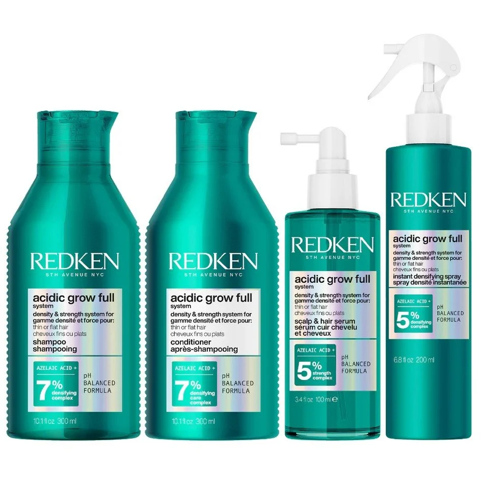 Four bottles of Redken Acidic Grow Full hair care products, including shampoo, conditioner, scalp and hair serum, and an aerosol spray, all with teal packaging.