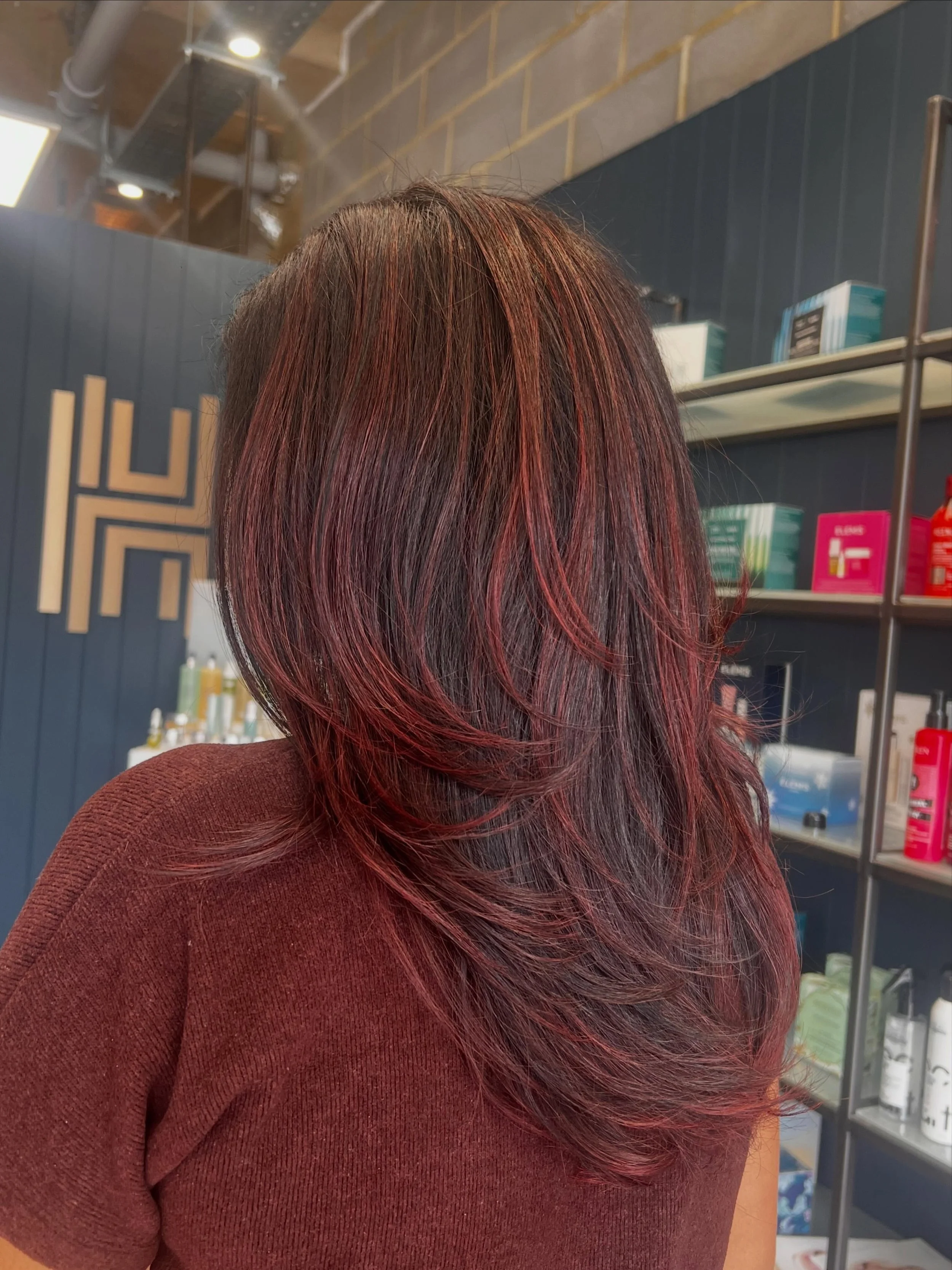 🍒🥤 Cherry Cola 🍒🥤

A dark brunette enhanced with ribbons of cherry red running through the hair to add dimension, shine, and that gorgeous glow. Finished with soft layers for movement and a bouncy blow dry!! 

We are obsessed with how Adam create