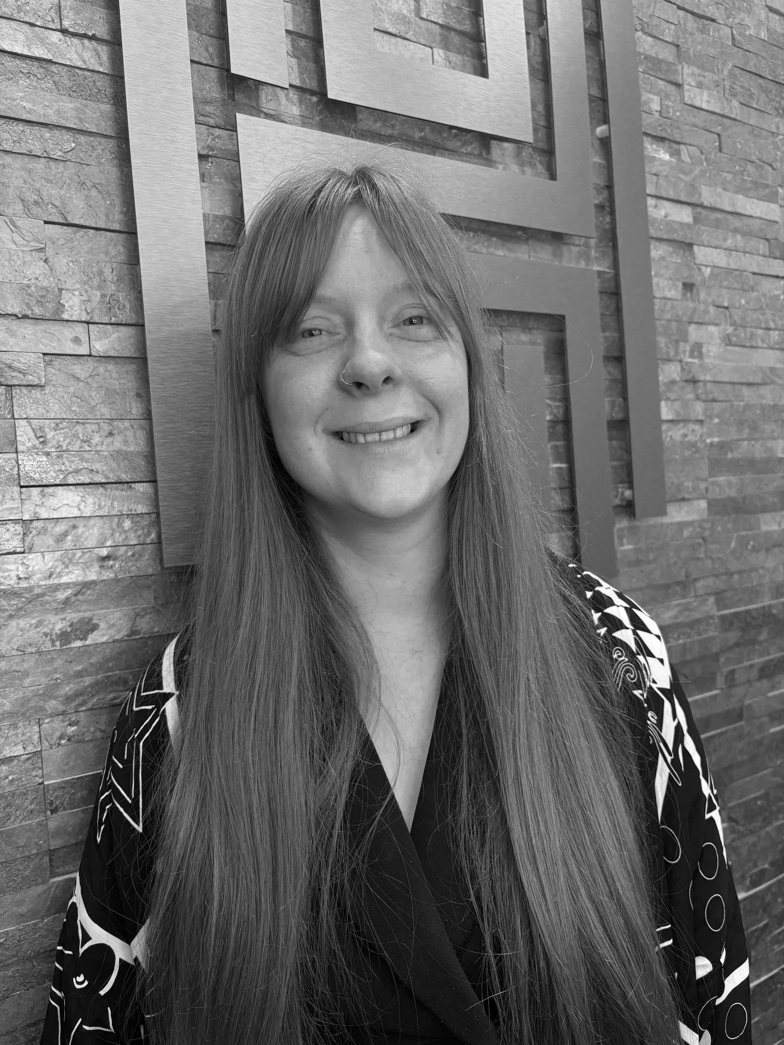 Lady with long hair and fringe smiling