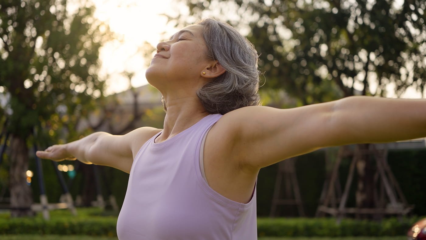 Woman outside doing yoga