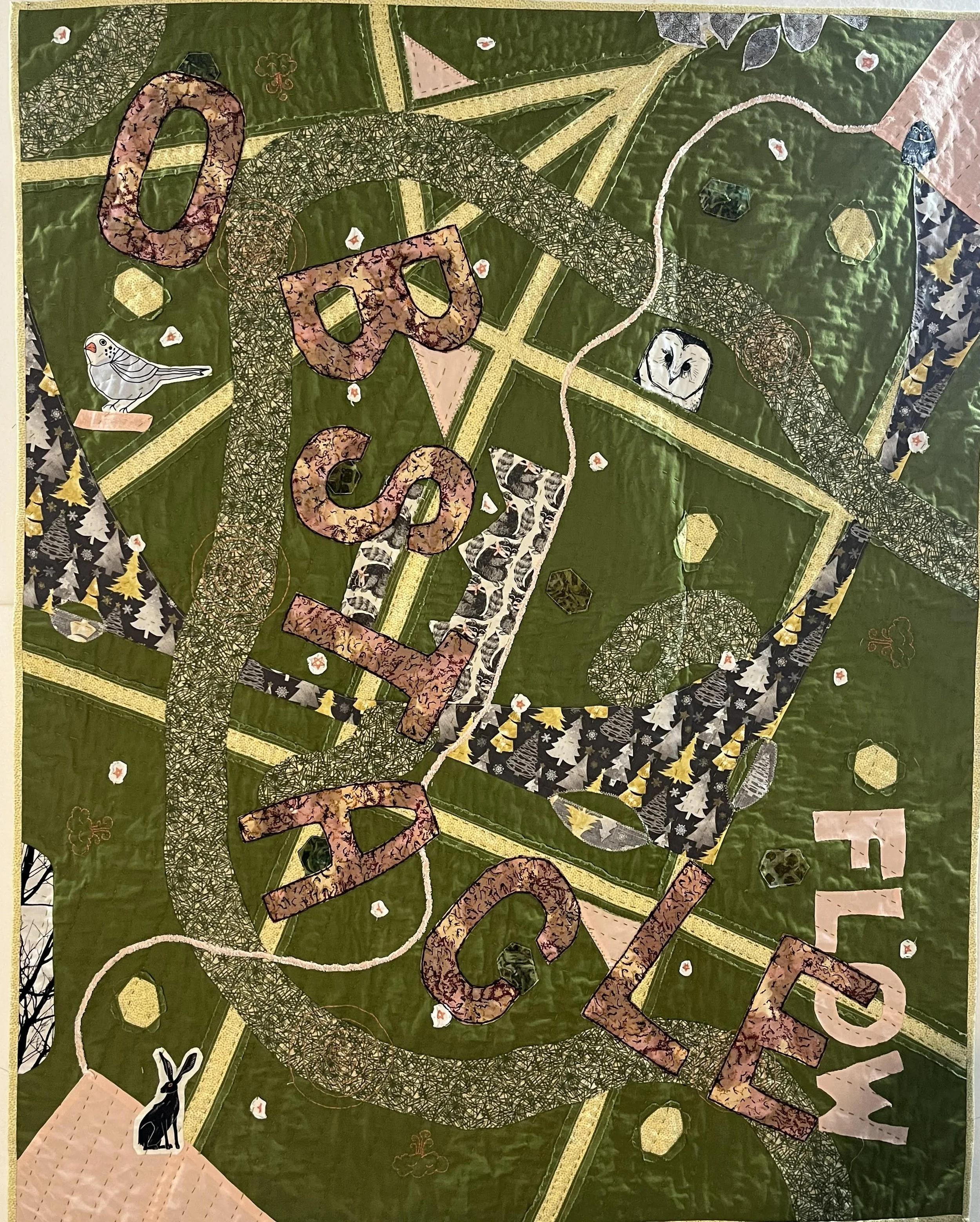 Image of an improvised quilt. The background is olive green and there is a greenish river shape that winds across. The word "Obstacle" overlays everything and lands in the lower right on the word "Flow"