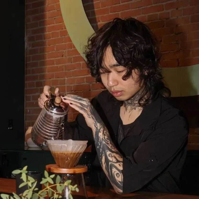 A barista making pourover coffee by hand at Slow by Slow Coffee, Boise ID