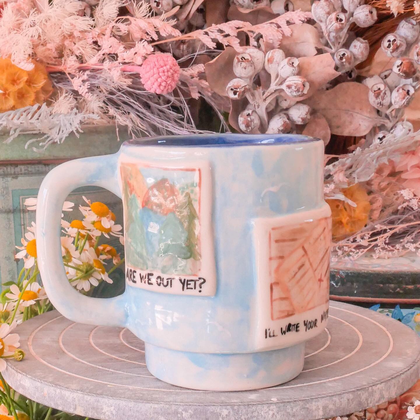 My Taylor Swift &lsquo;1989&rsquo; mug is filled with polaroids and a peaceful blues 🌊📷

I loved creating this mug and being able to add in all of the references to this beautiful album! I especially loved painting Taylor&rsquo;s cat Olivia Benson 