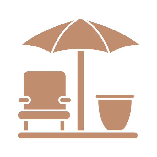Beach chair, umbrella, and potted plant on a wooden surface.