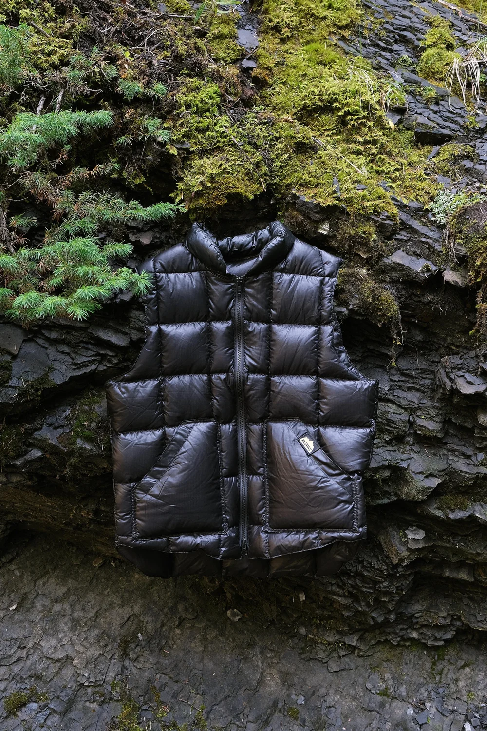 Black Kluane Down Vest on rocks