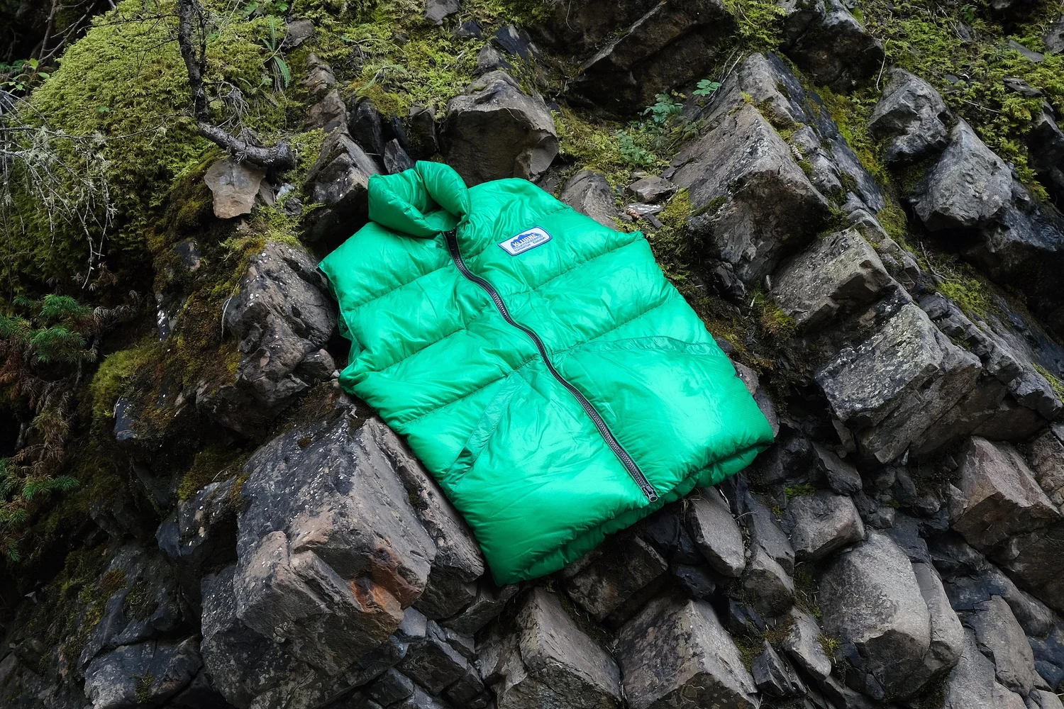 Green Kluane Down Vest on rocks