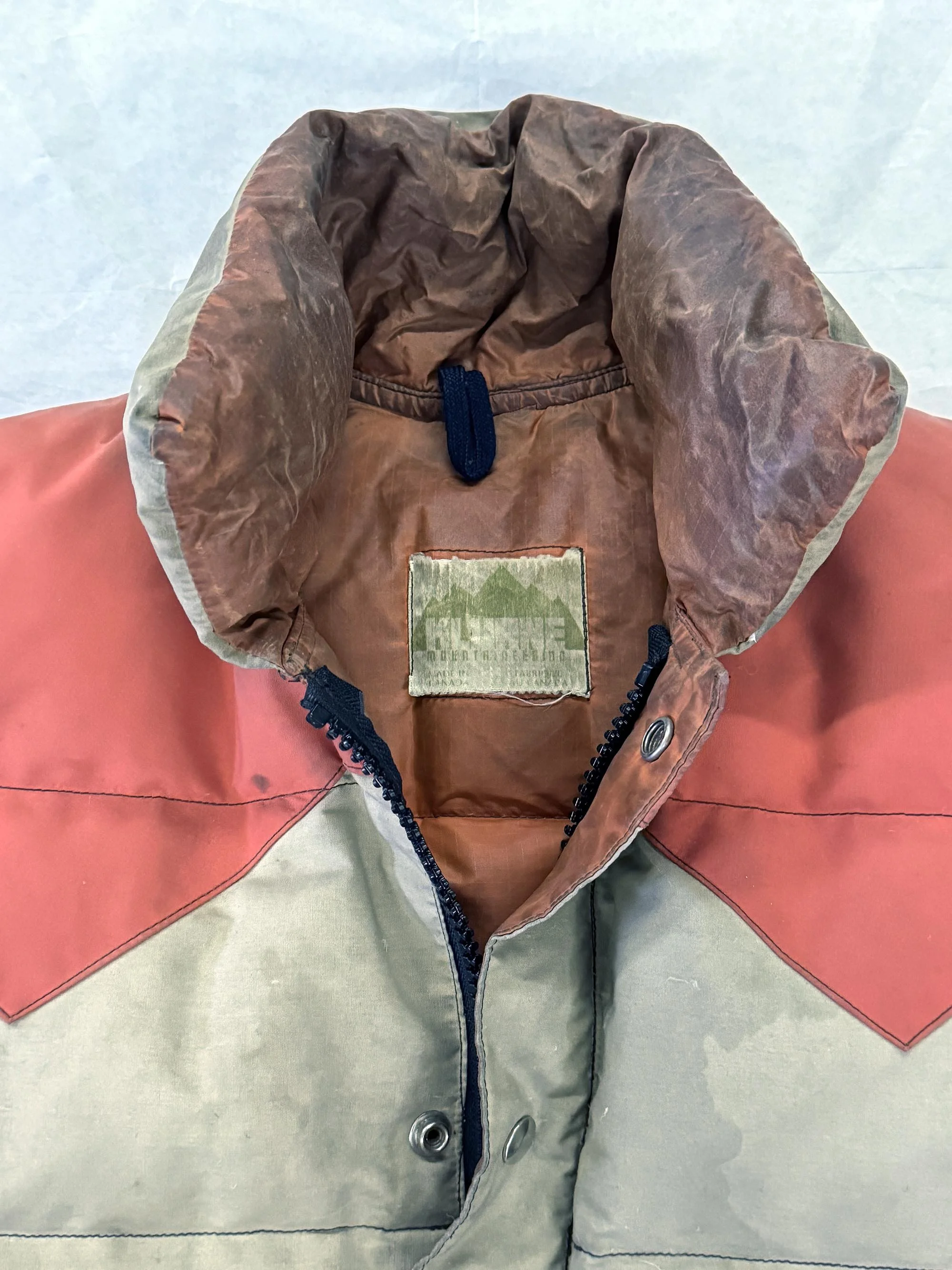 Worn vintage Kluane Mountaineering garment with faded label