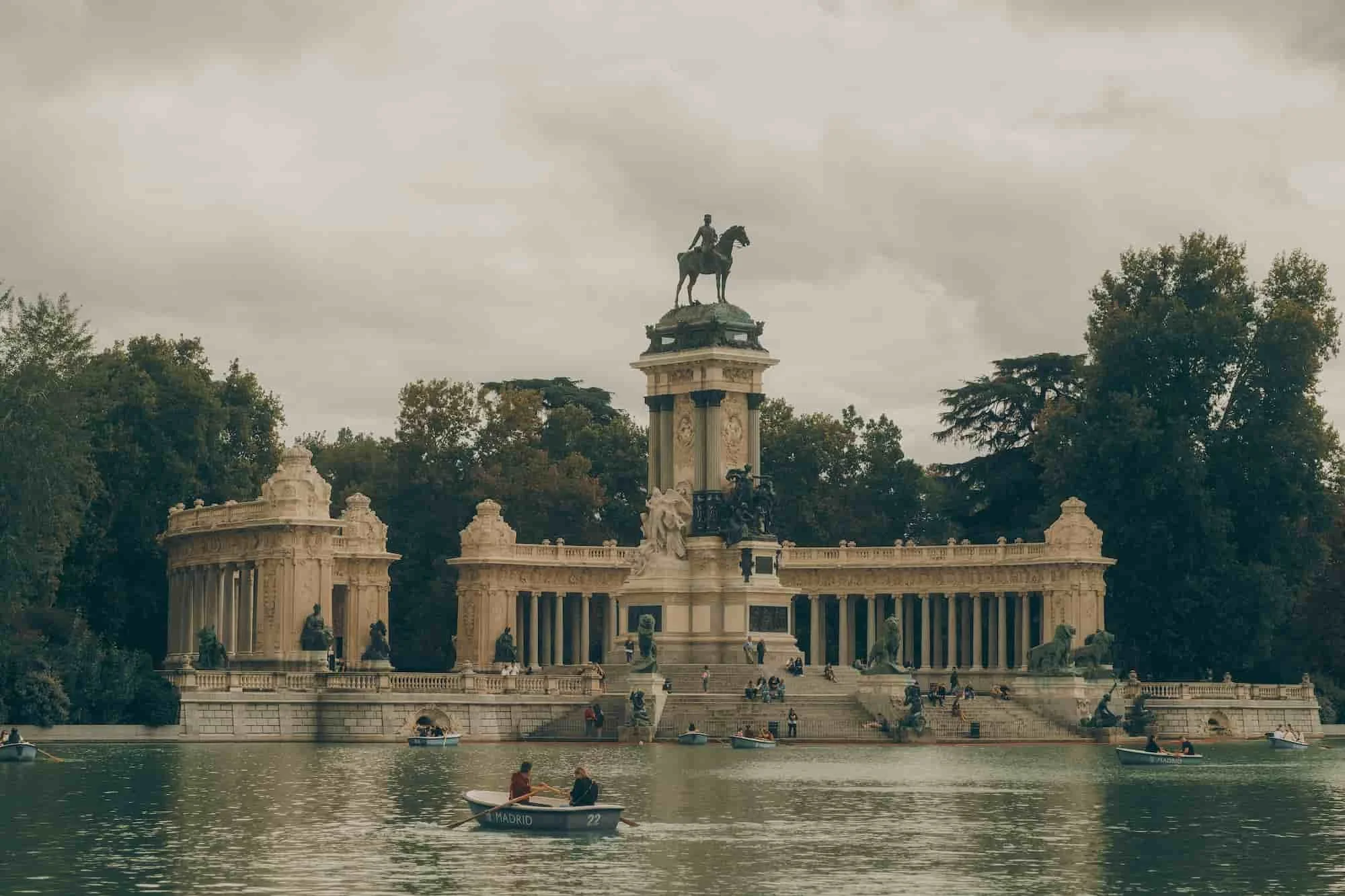 People on a boat, in a pond in Madrid, thinking about opening a subsidiary in Spain