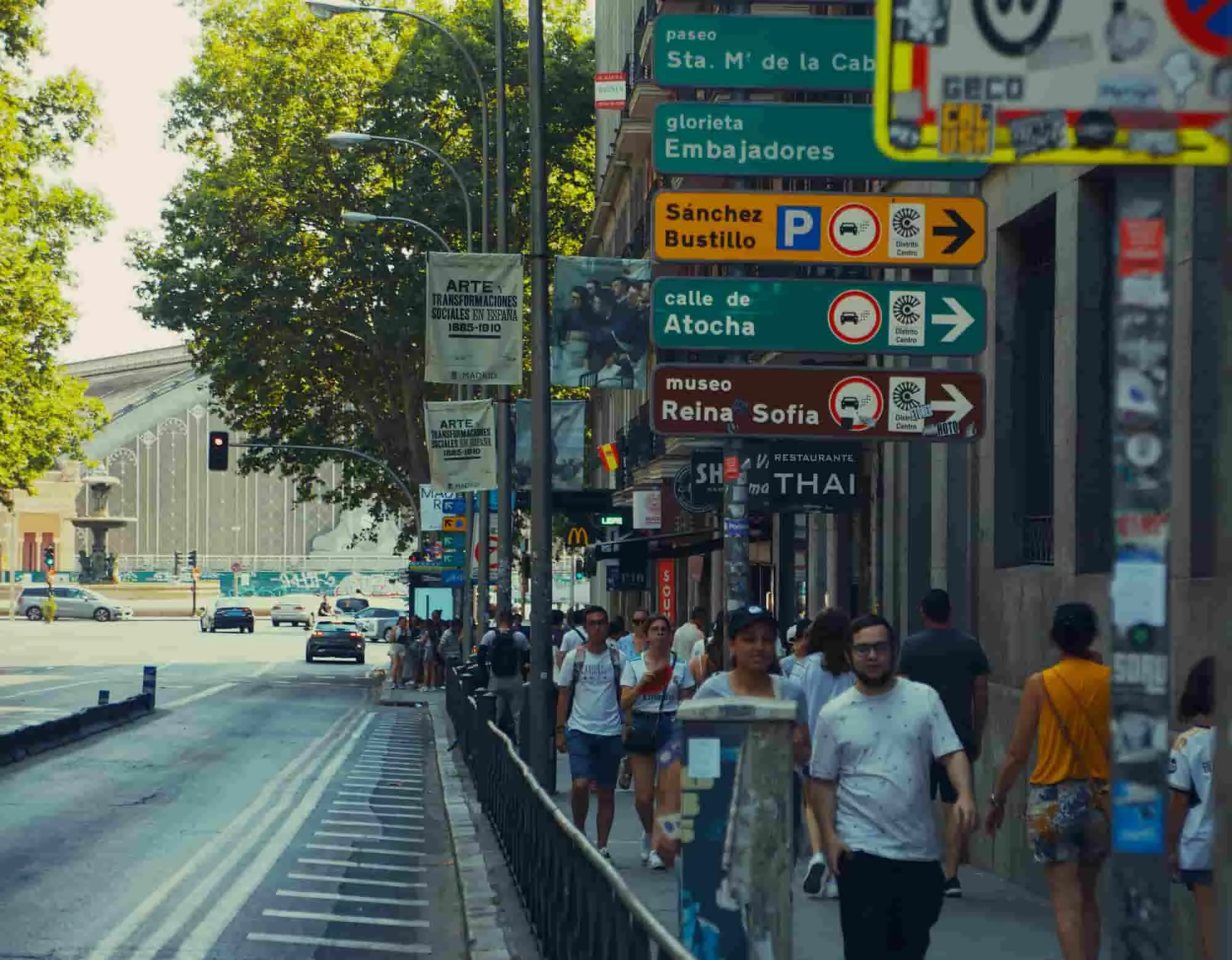 Setting up a subsidiary in Spain: street signs in Madrid and people walking by