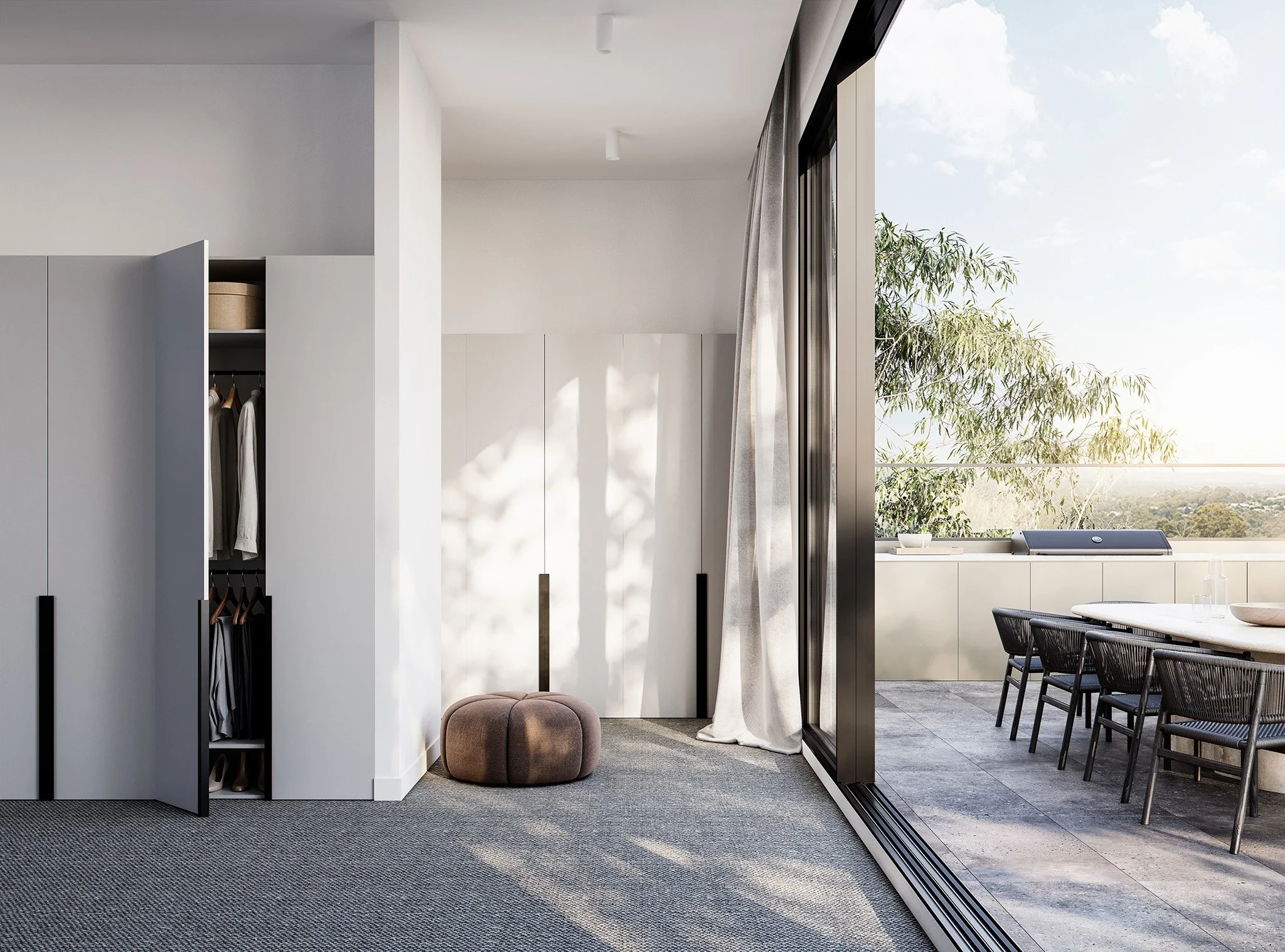 Modern interior room with a closet, brown pouf, and large glass sliding door leading to an outdoor balcony with seating and greenery.