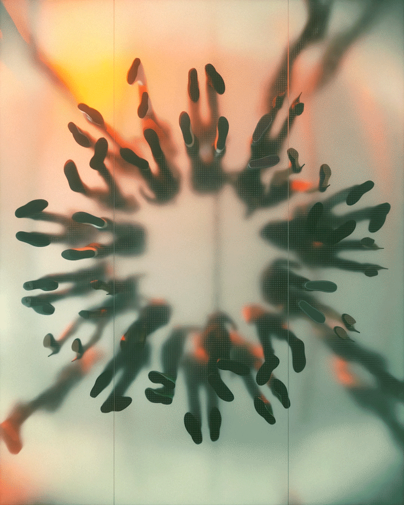 View looking up through a glass surface with reflections of multiple footprints, creating a circular pattern.
