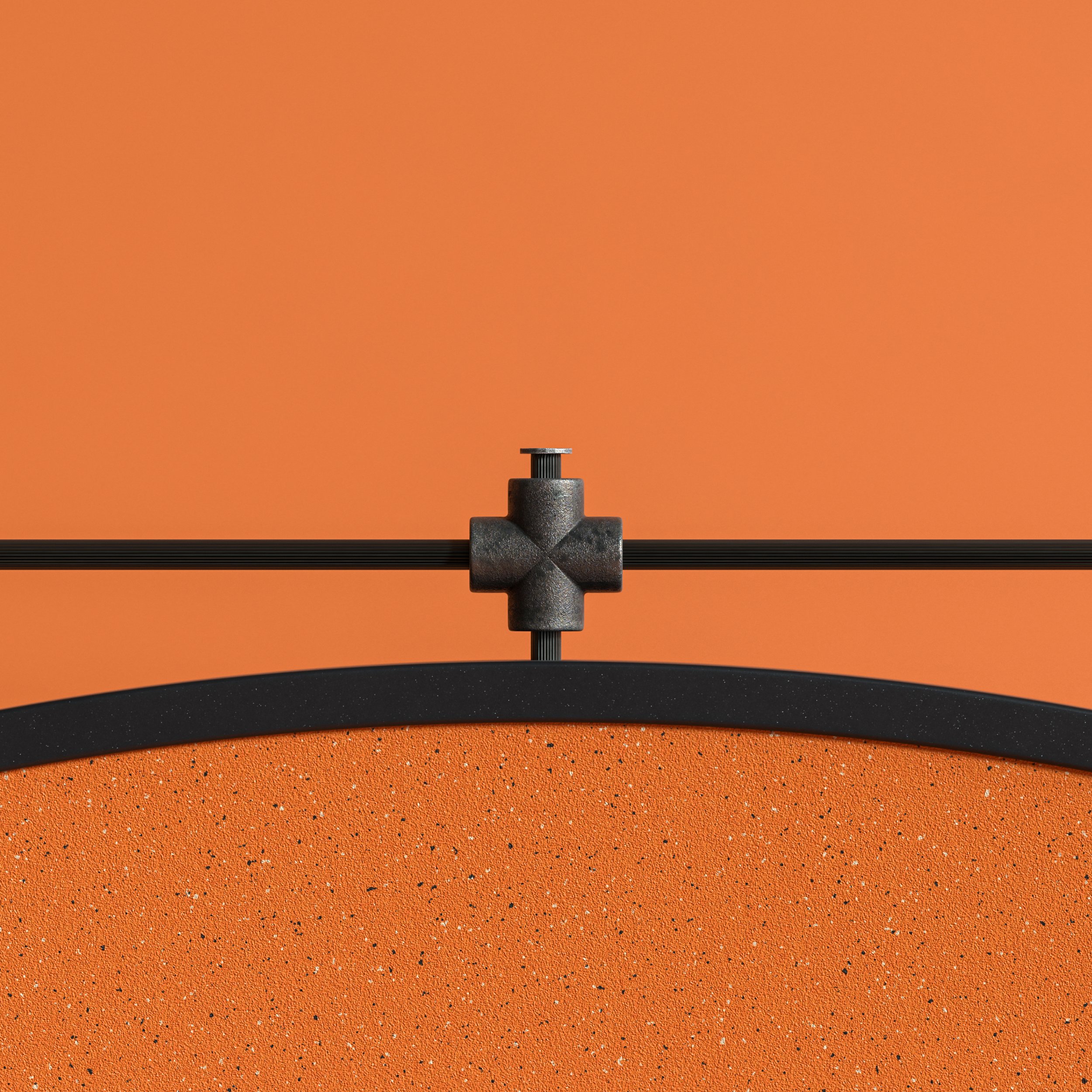 Close-up of a black metal clamp fixture, fastening a thin black cable to an orange textured surface, with an orange background.