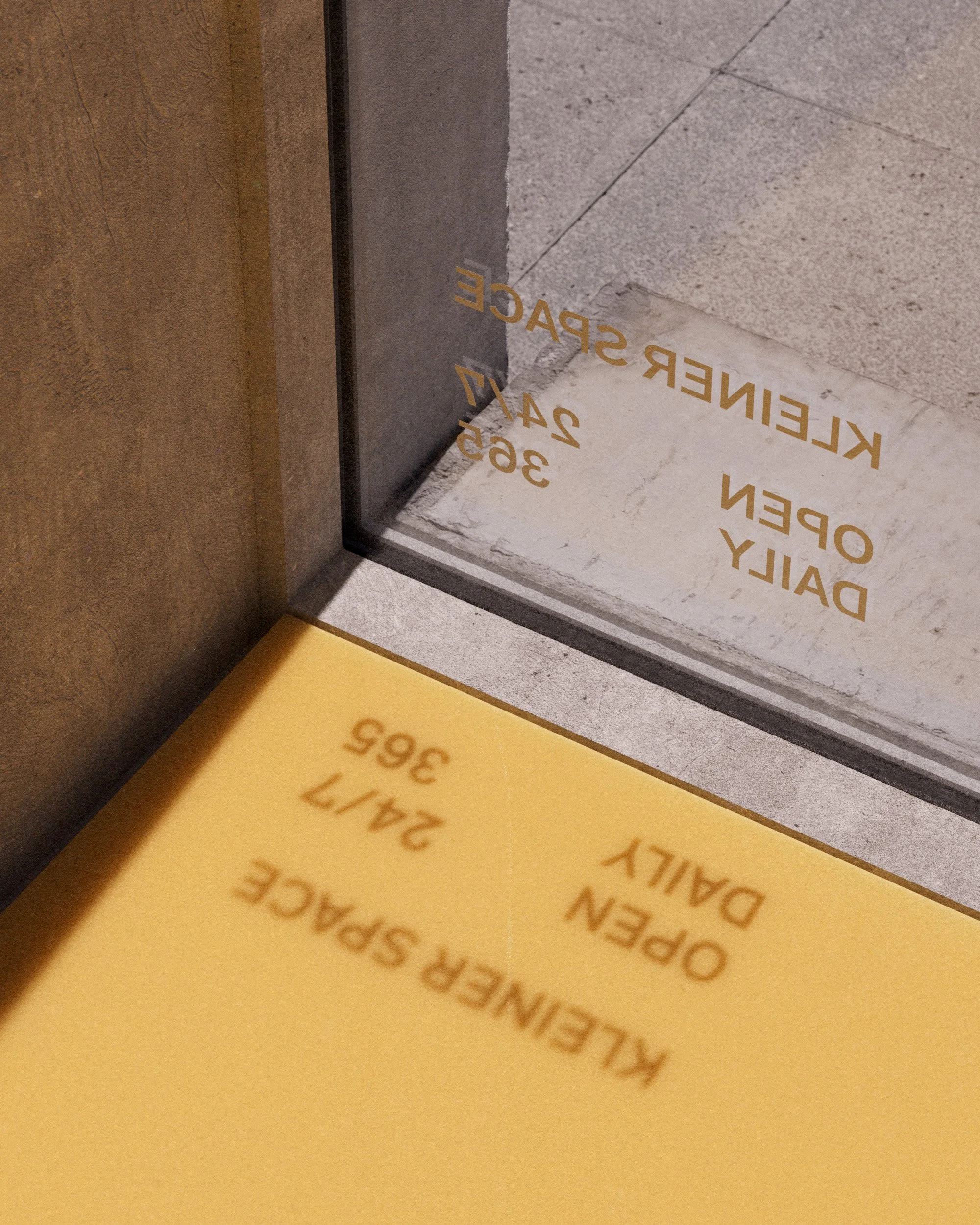 View of glass door with gold lettering indicating 'KLEINER SPACE' and business hours, with a yellow wall reflecting text about a management space open daily from 6 am to 9 pm.