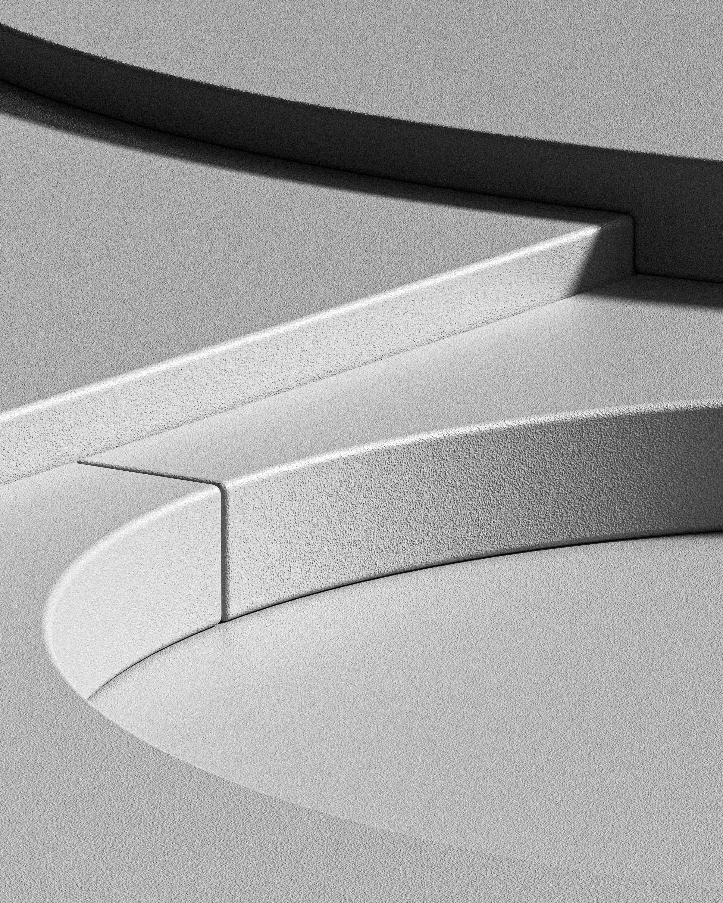 Close-up of a silver, textured electronic device with rounded edges and a curved surface.