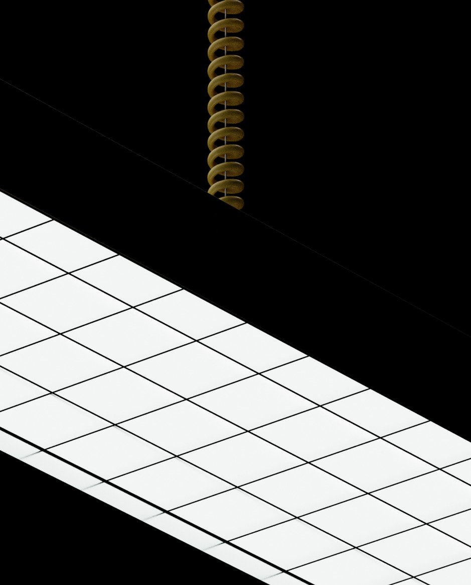 Close-up of a spiral light fixture illuminating a white tiled surface.