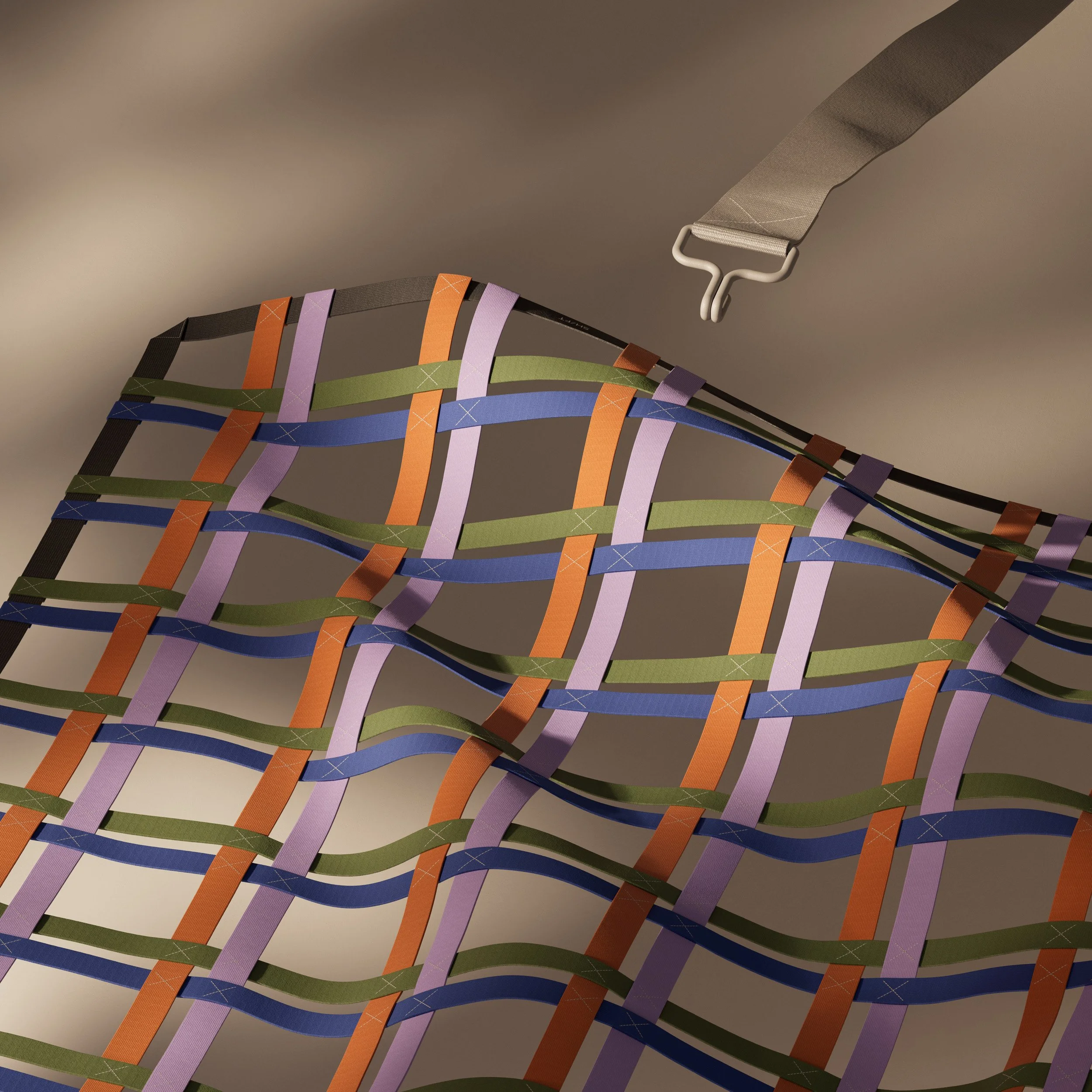 Abstract woven textile of interlaced fabric straps in muted orange, lavender, green, and blue, forming a flowing architectural grid against a soft neutral background.