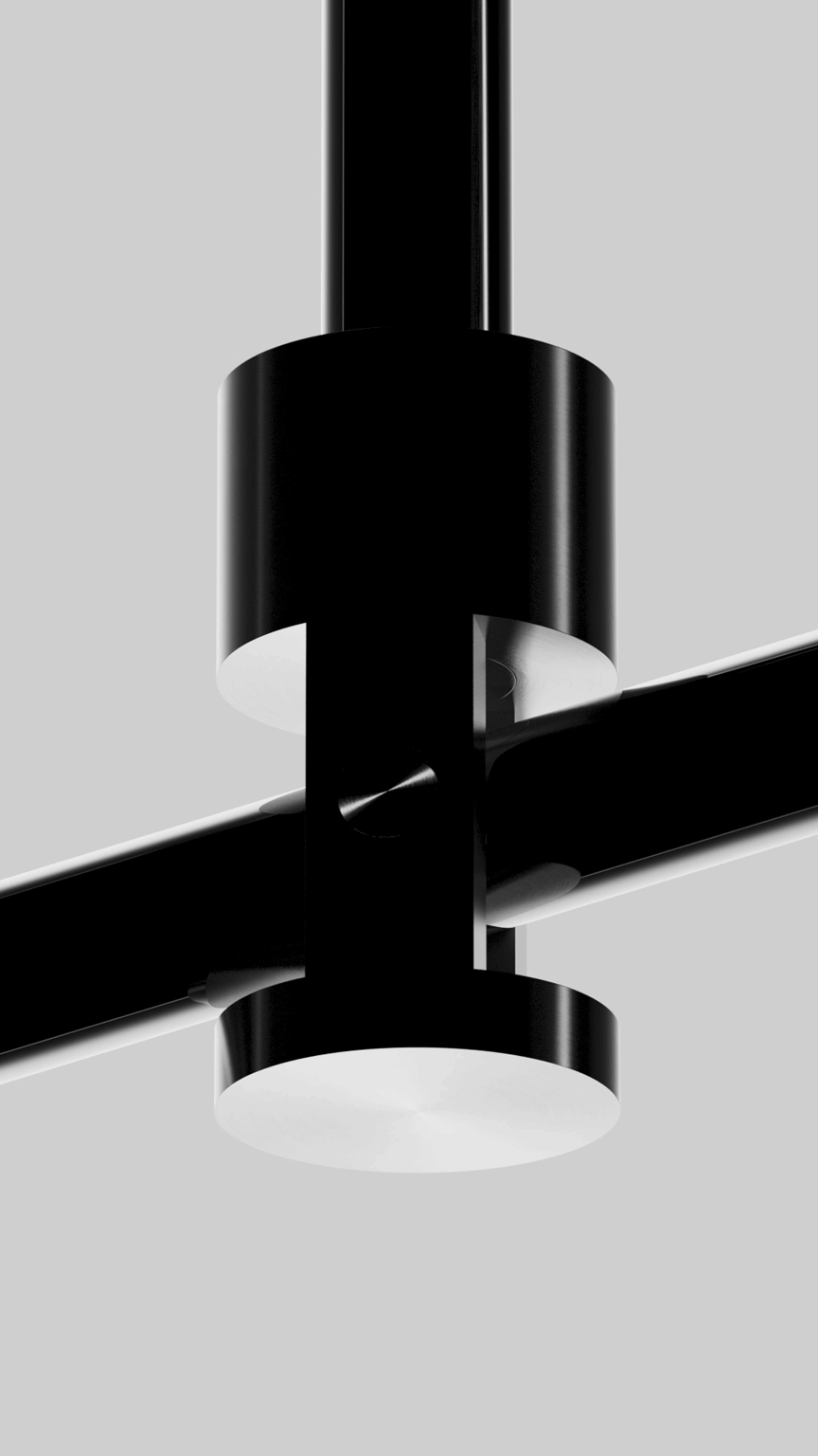Close-up of a modern black and white LED ceiling light fixture with a cylindrical design.