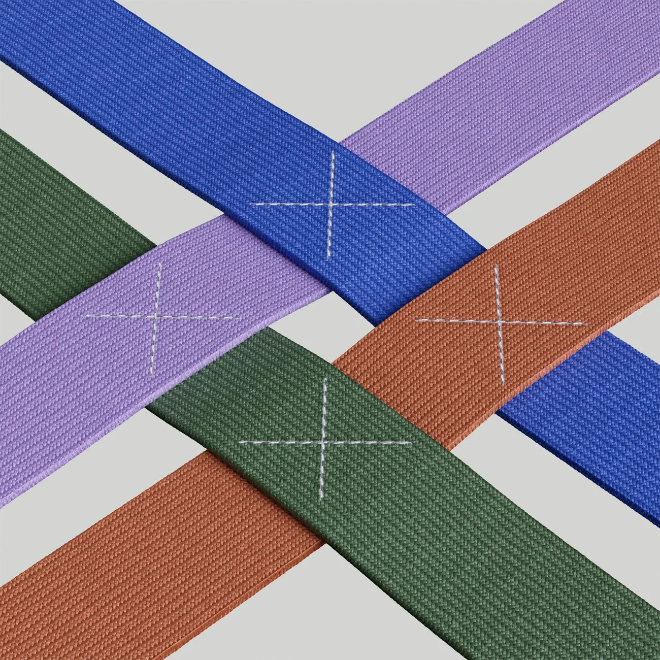 Multiple colorful woven straps crossing each other with stitched X marks on each strap.
