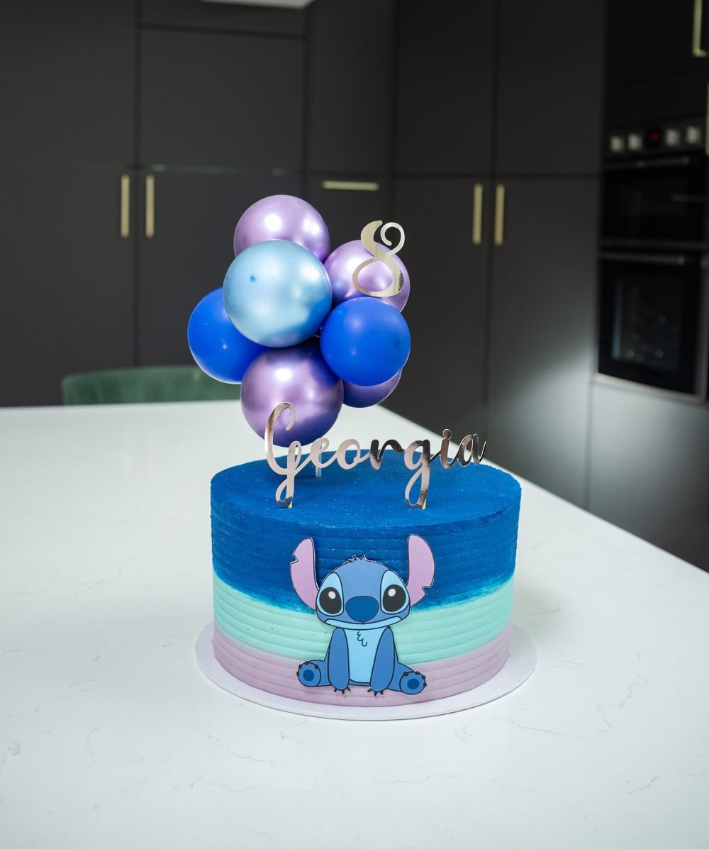Stitch themed birthday cake with balloon topper