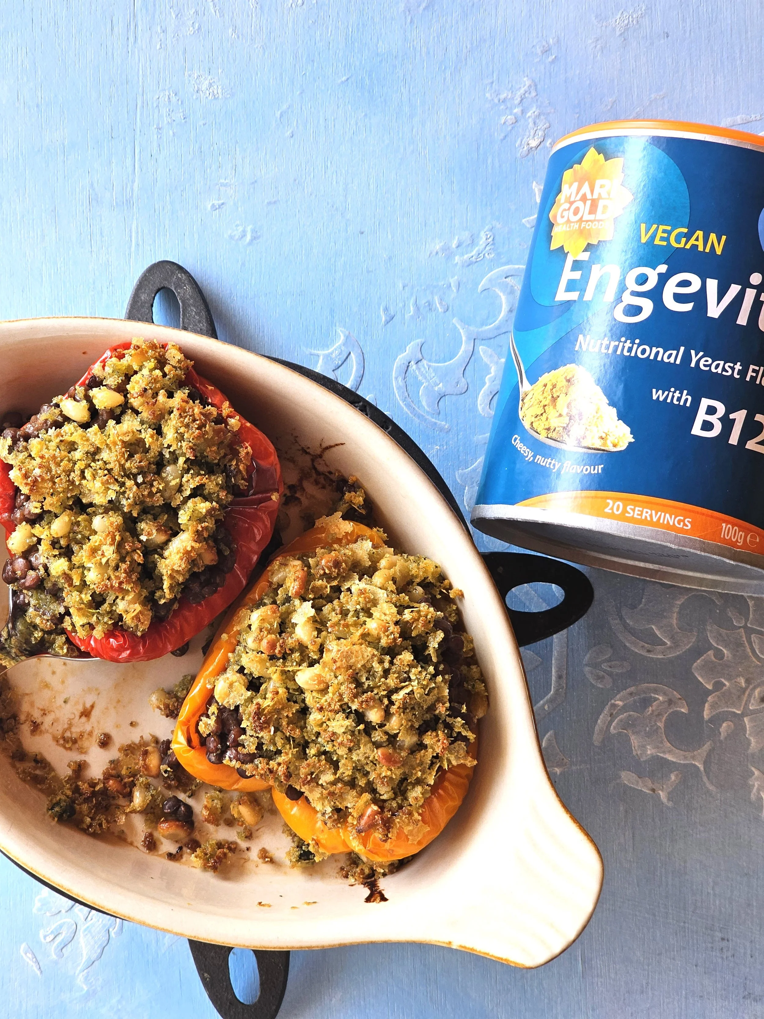 Stuffed peppers with tomato lentils and herby nooch breadcrumbs