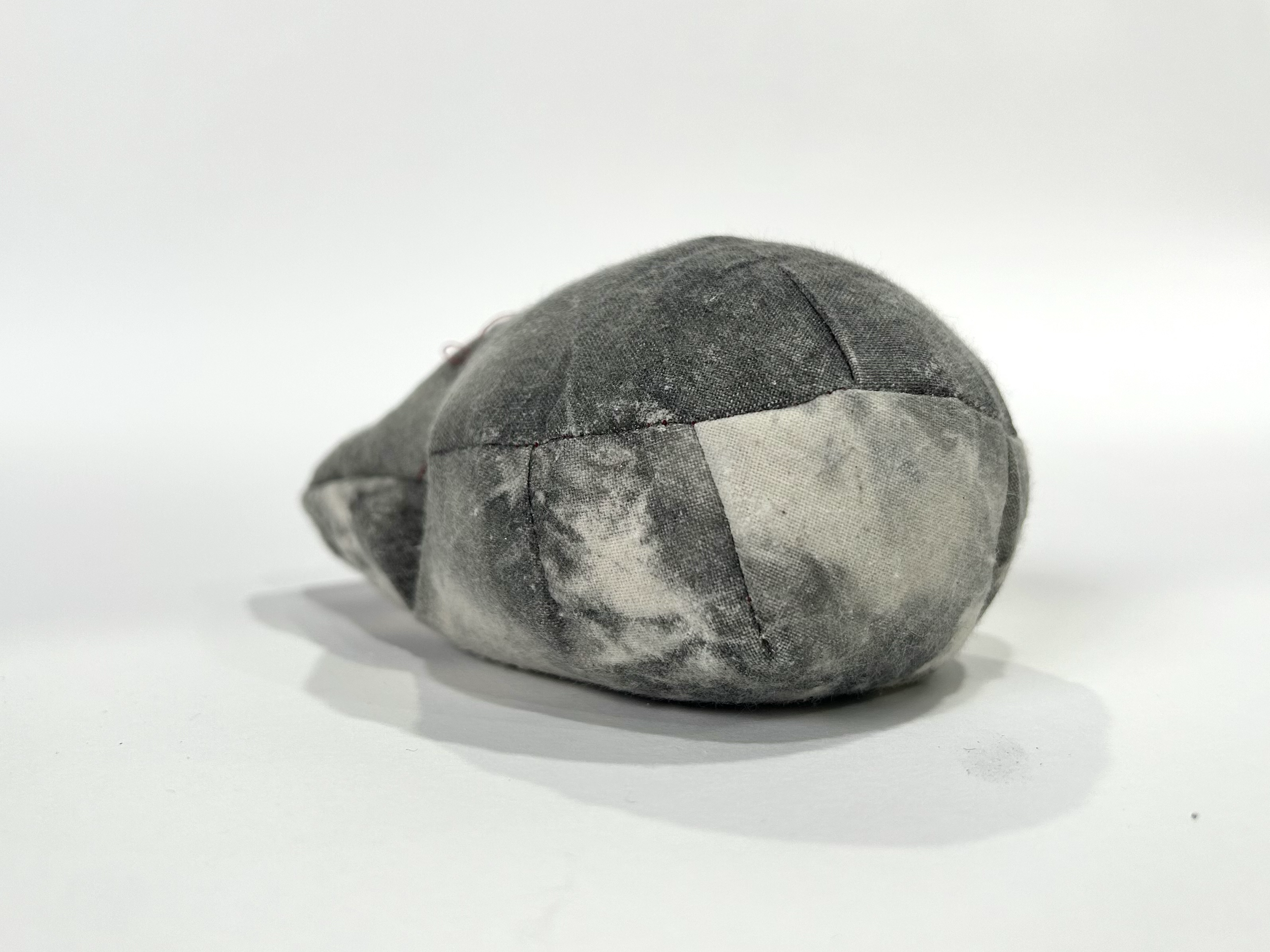 Calico coated in Liquid Light photographic emulsion, exposed, sewn, filled with plaster and lead