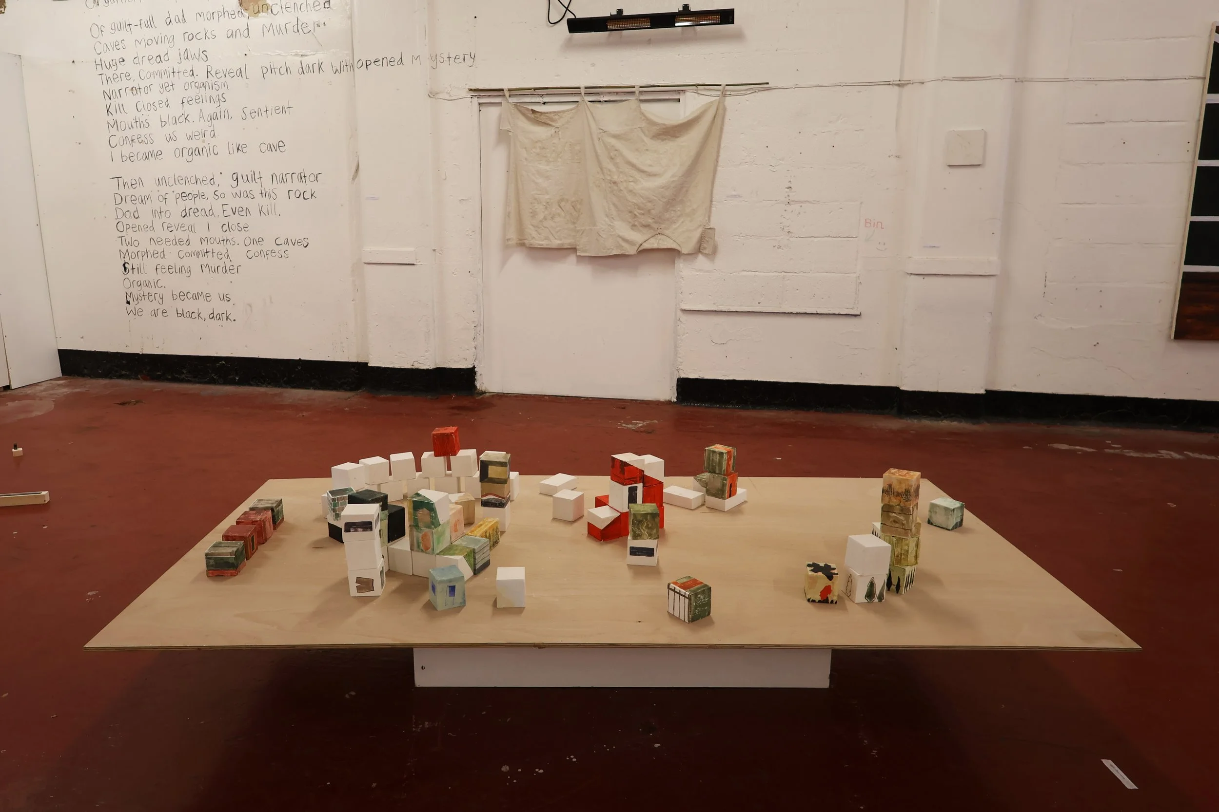 Blocks, acrylic on plaster, each 9 x 9 x 9 cm, 2026 (installation view from 'Interim' exhibition at Fusion Arts, March, 2026)