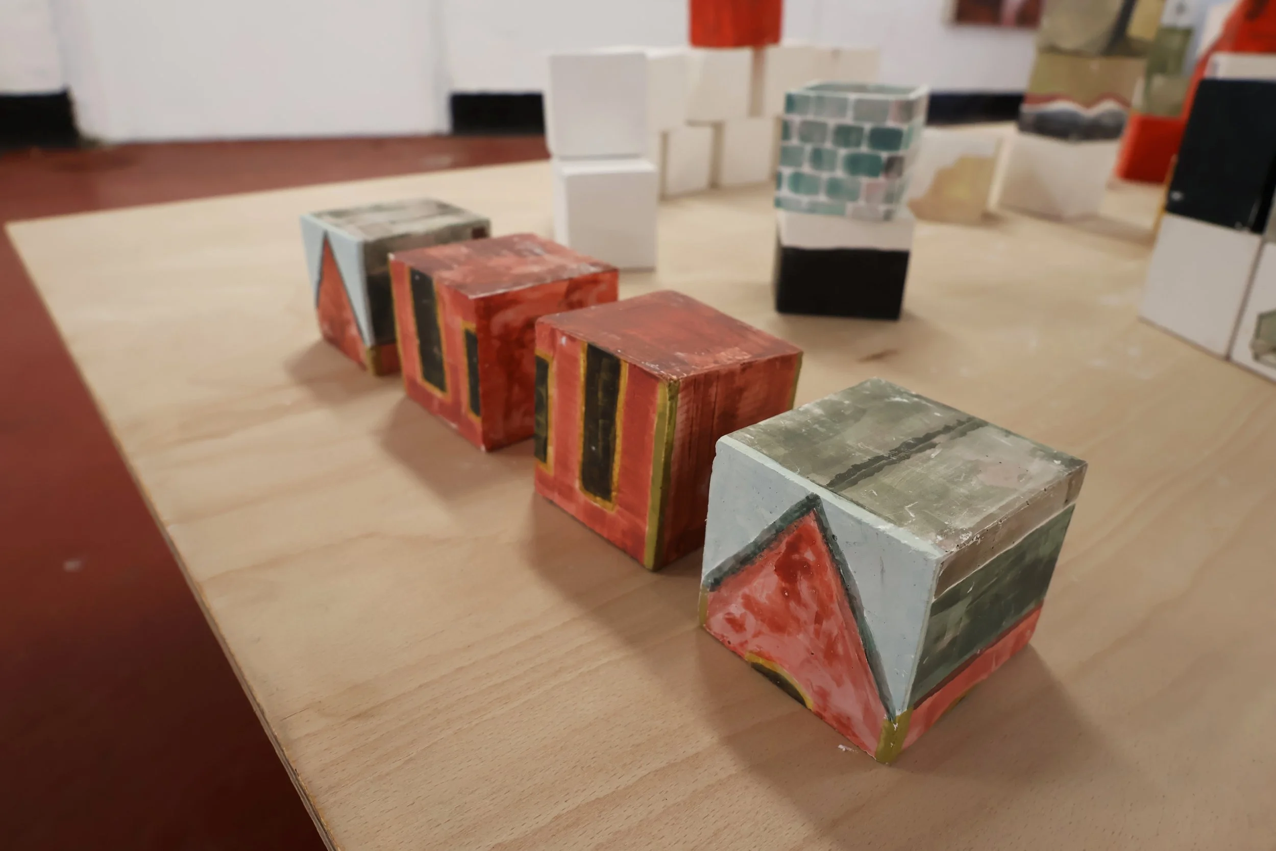 Blocks, acrylic on plaster, each 9 x 9 x 9 cm, 2026 (installation view from 'Interim' exhibition at Fusion Arts, March, 2026)