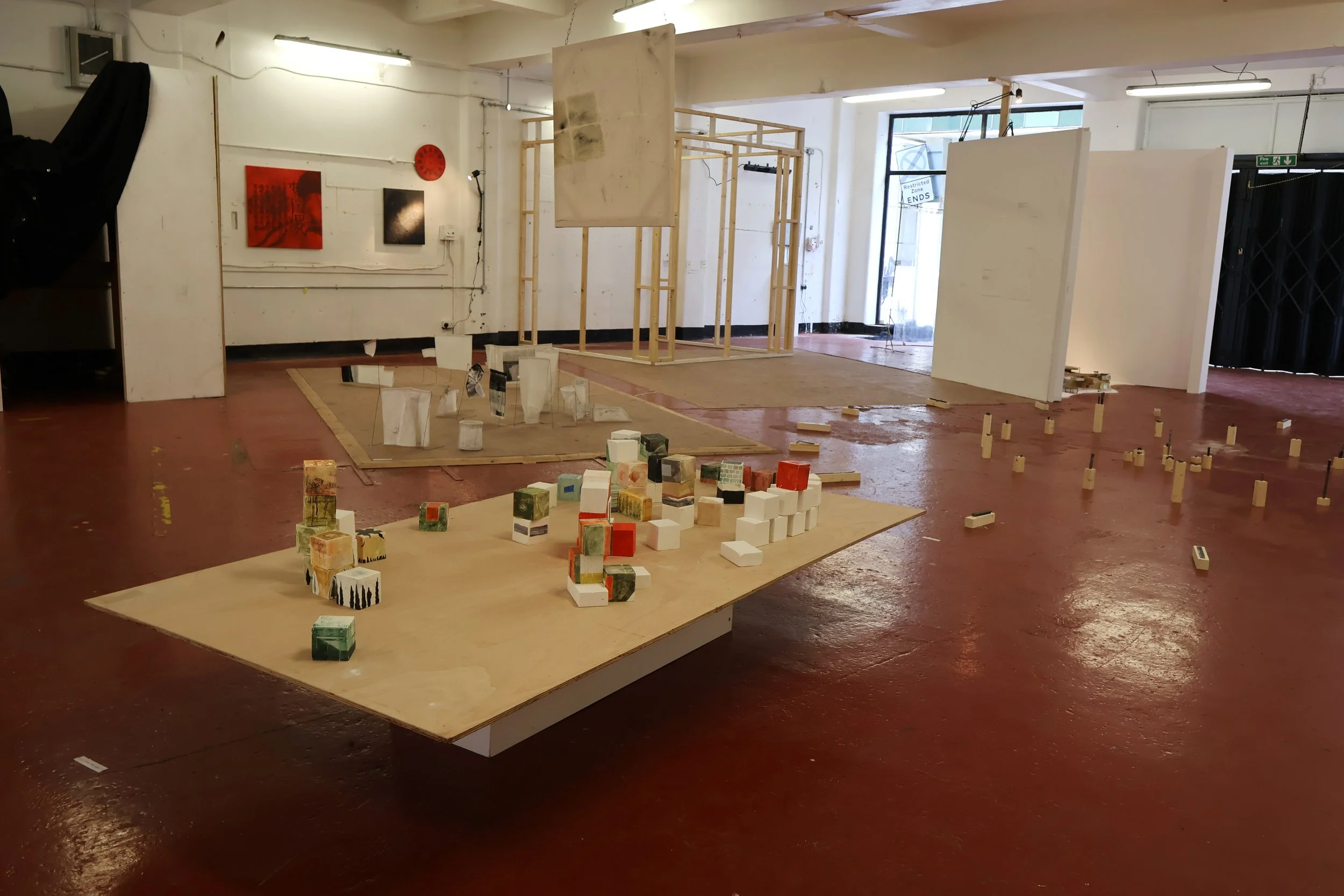 Blocks, acrylic on plaster, each 9 x 9 x 9 cm, 2026 (installation view from 'Interim' exhibition at Fusion Arts, March, 2026)