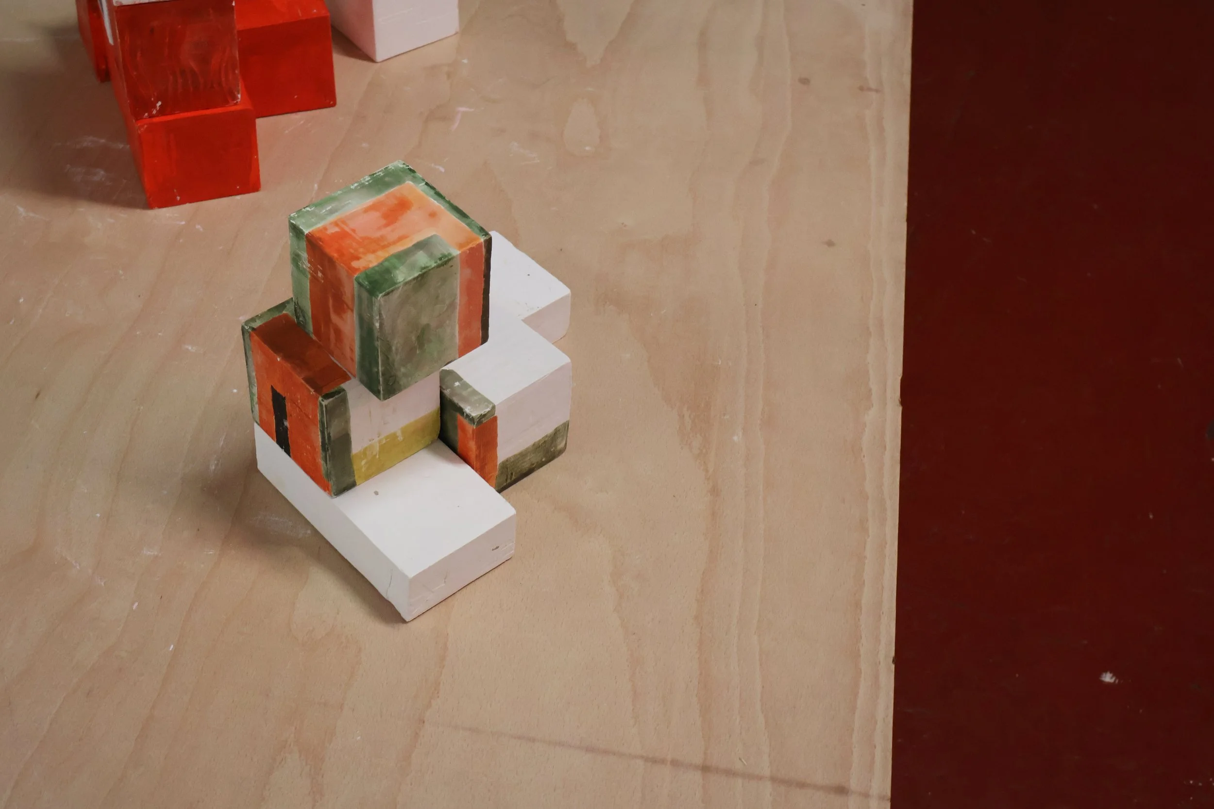 Blocks, acrylic on plaster, each 9 x 9 x 9 cm, 2026 (installation view from 'Interim' exhibition at Fusion Arts, March, 2026)