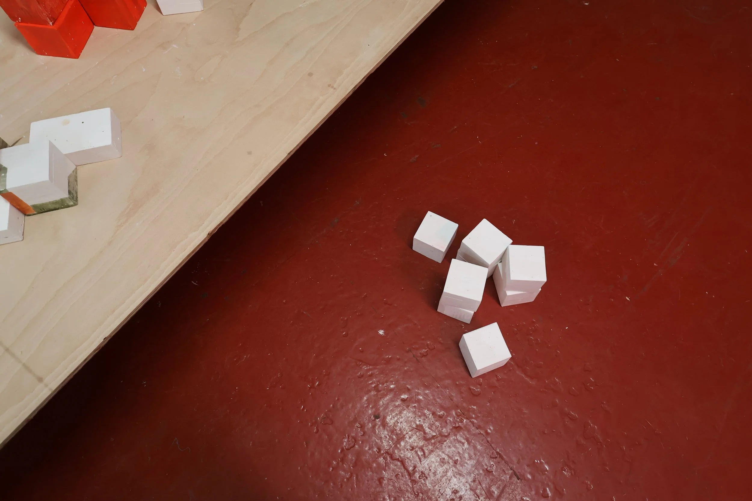 Blocks, acrylic on plaster, each 9 x 9 x 9 cm, 2026 (installation view from 'Interim' exhibition at Fusion Arts, March, 2026)