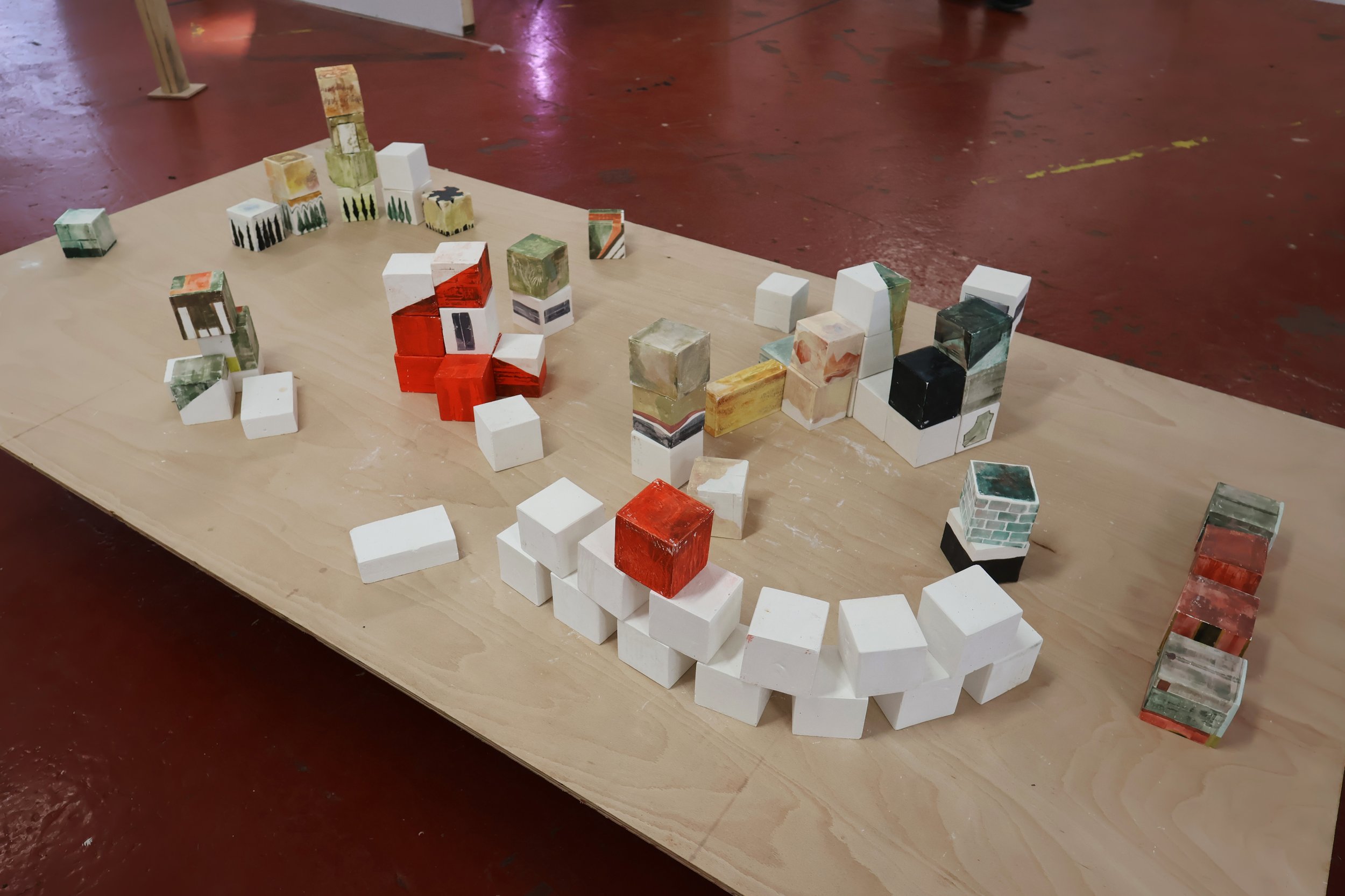 Blocks, acrylic on plaster, each 9 x 9 x 9 cm, 2026 (installation view from 'Interim' exhibition at Fusion Arts, March, 2026)
