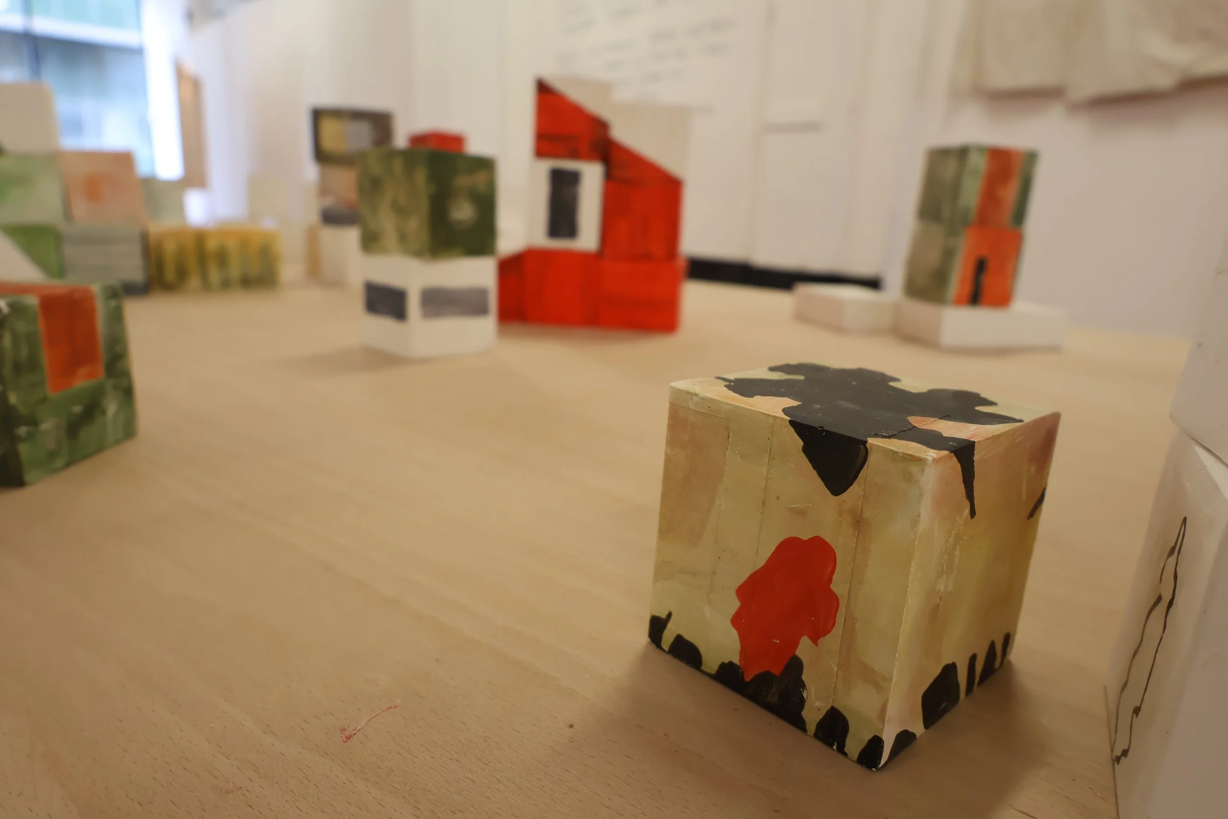 Blocks, acrylic on plaster, each 9 x 9 x 9 cm, 2026 (installation view from 'Interim' exhibition at Fusion Arts, March, 2026)