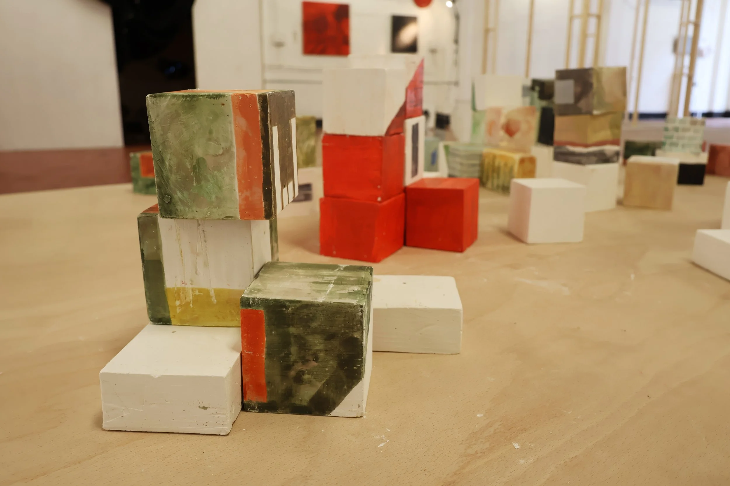 Blocks, acrylic on plaster, each 9 x 9 x 9 cm, 2026 (installation view from 'Interim' exhibition at Fusion Arts, March, 2026)