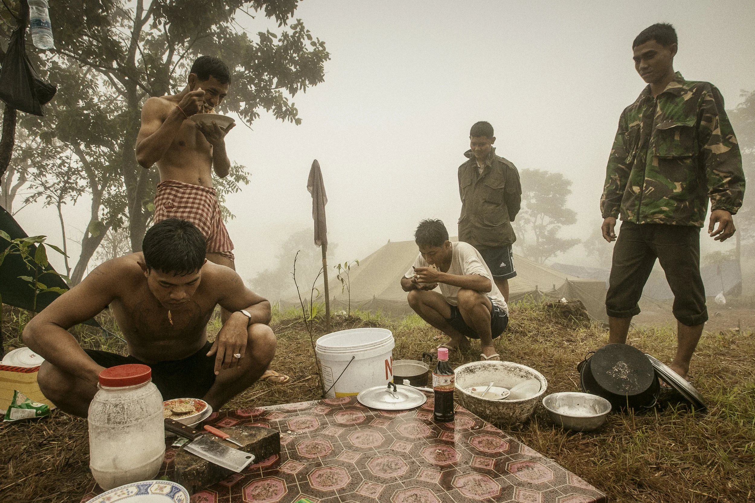 The morning meal with RCAF soldiers shrouded in mist atop the mountain.