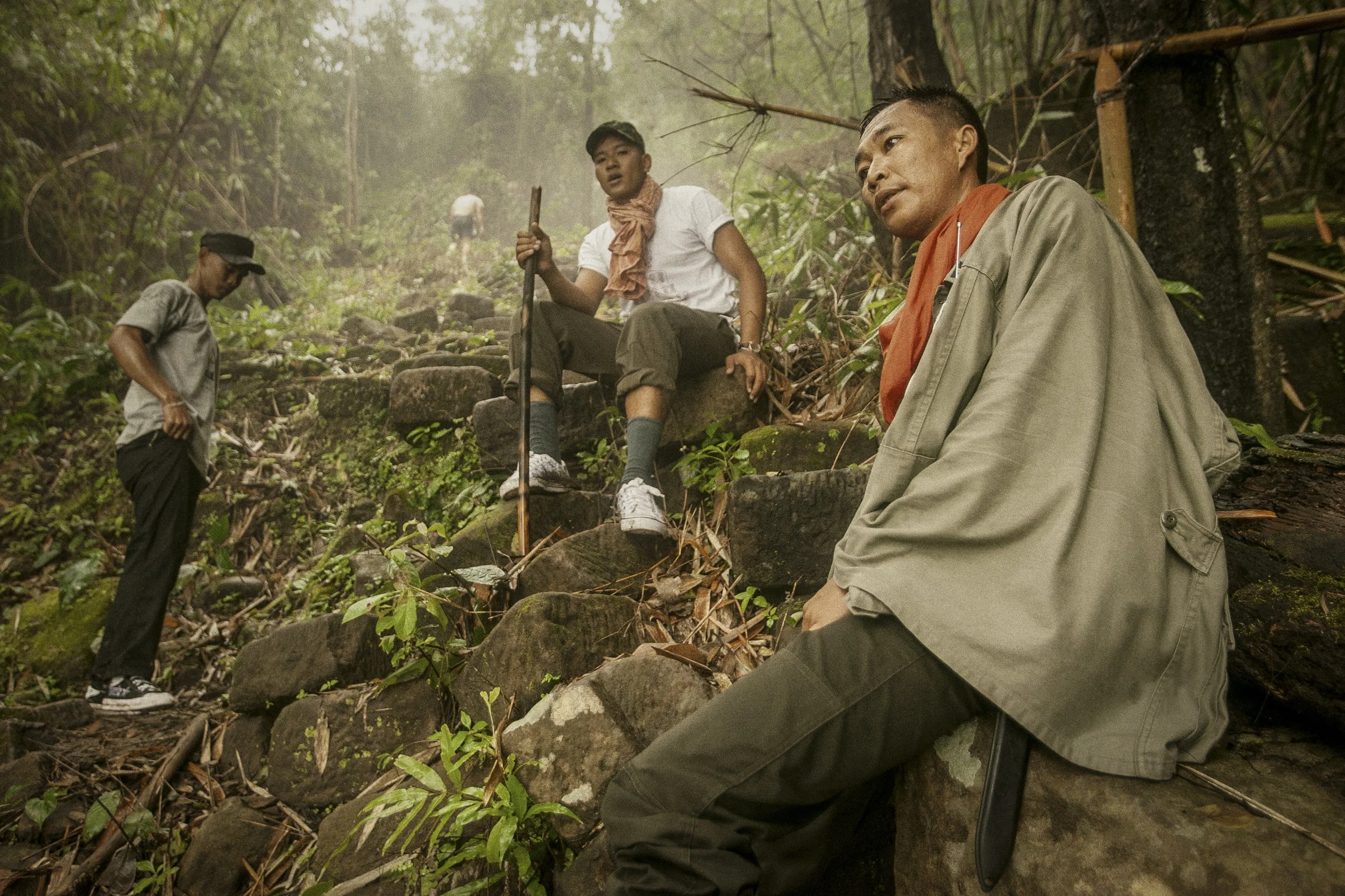 This early morning physical training reaches the halfway point as these Cambodian troops take a break as they prepare for their steep ascent back up the escarpment through the jungle.