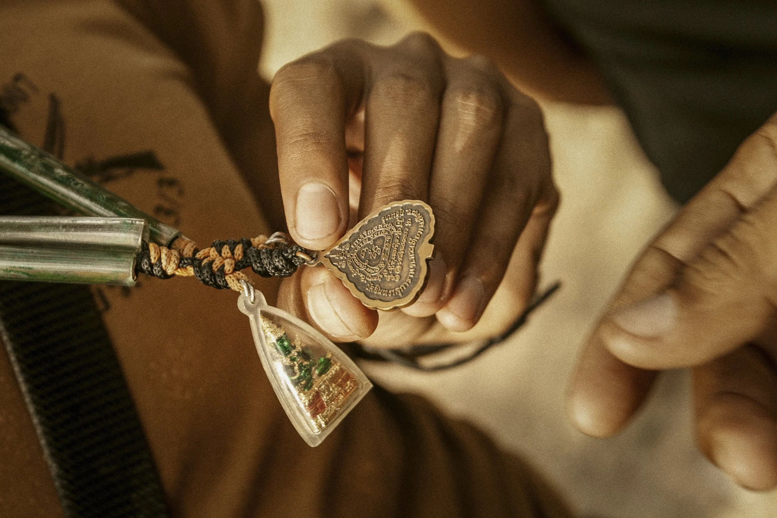 The protective amulet or sacred and blessed talismans worn by Thai and Cambodian soldiers alike are thought to provide them with safety, luck and strength. Known to Cambodians as Kru Khmer, pendants and scrolls also protect against malevolent spirits