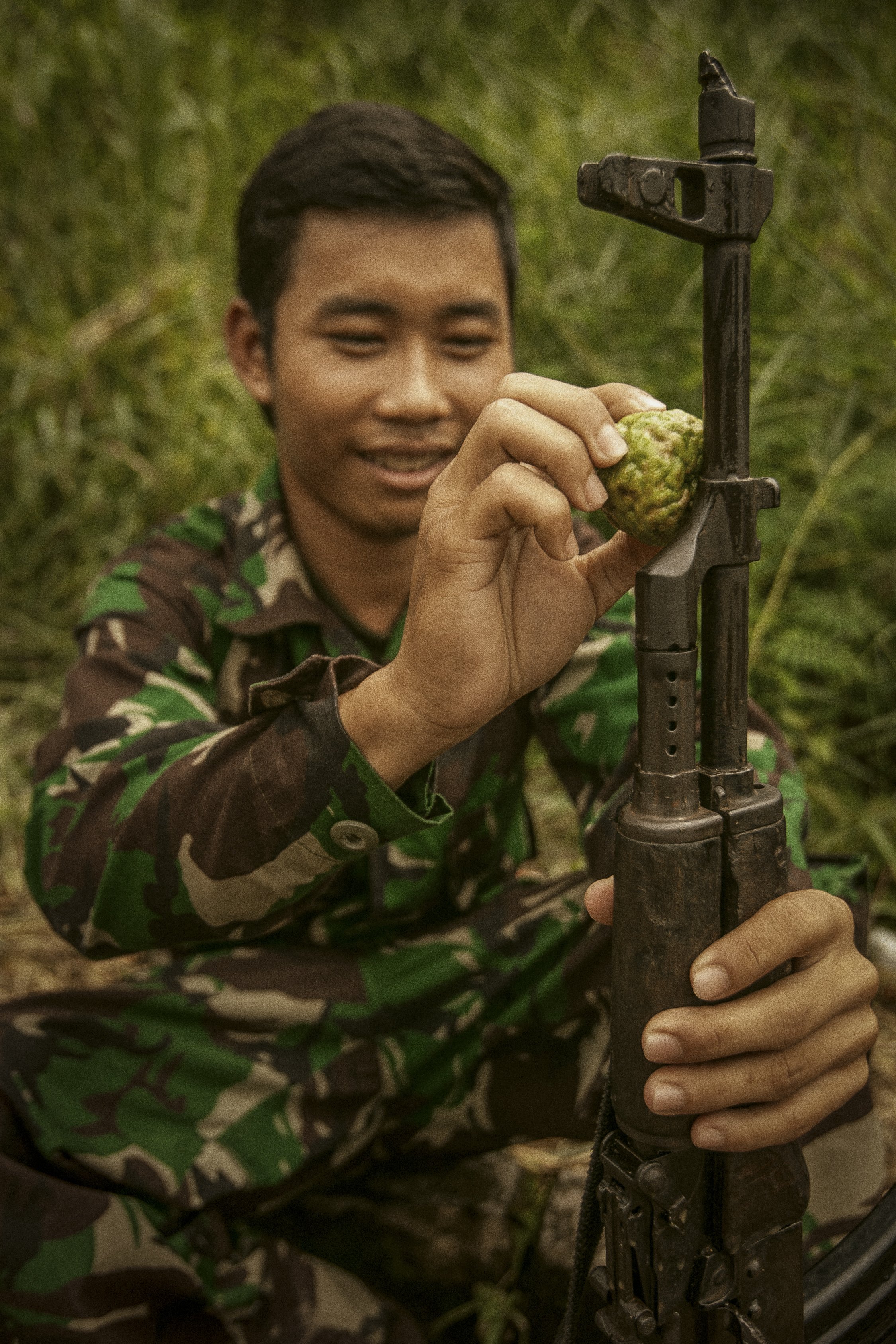 This resourceful RCAF soldier lubricates his vintage Soviet area AK-47 with oils from the Makrut Lime.