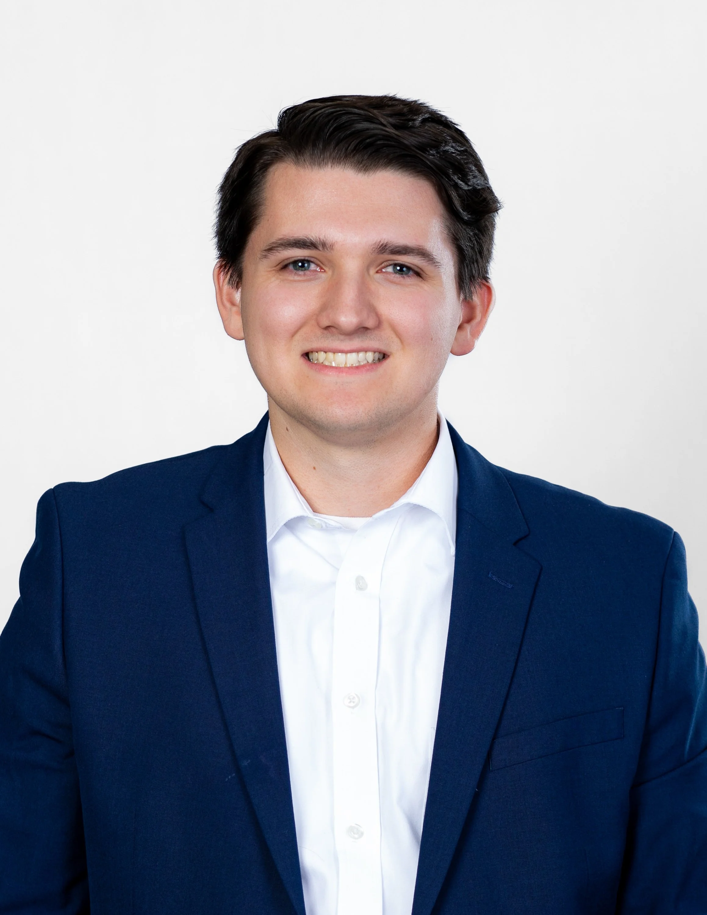 emerging-professionals-network-headshot-white-collar-blue-jacket.jpg