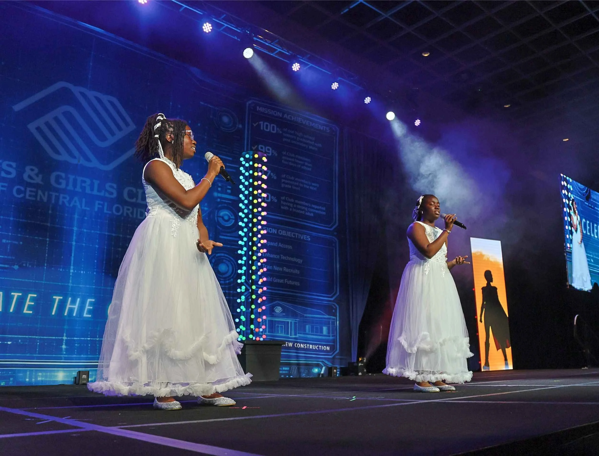 Singers performing on stage during the fundraising gala at Rosen Shingle Creek