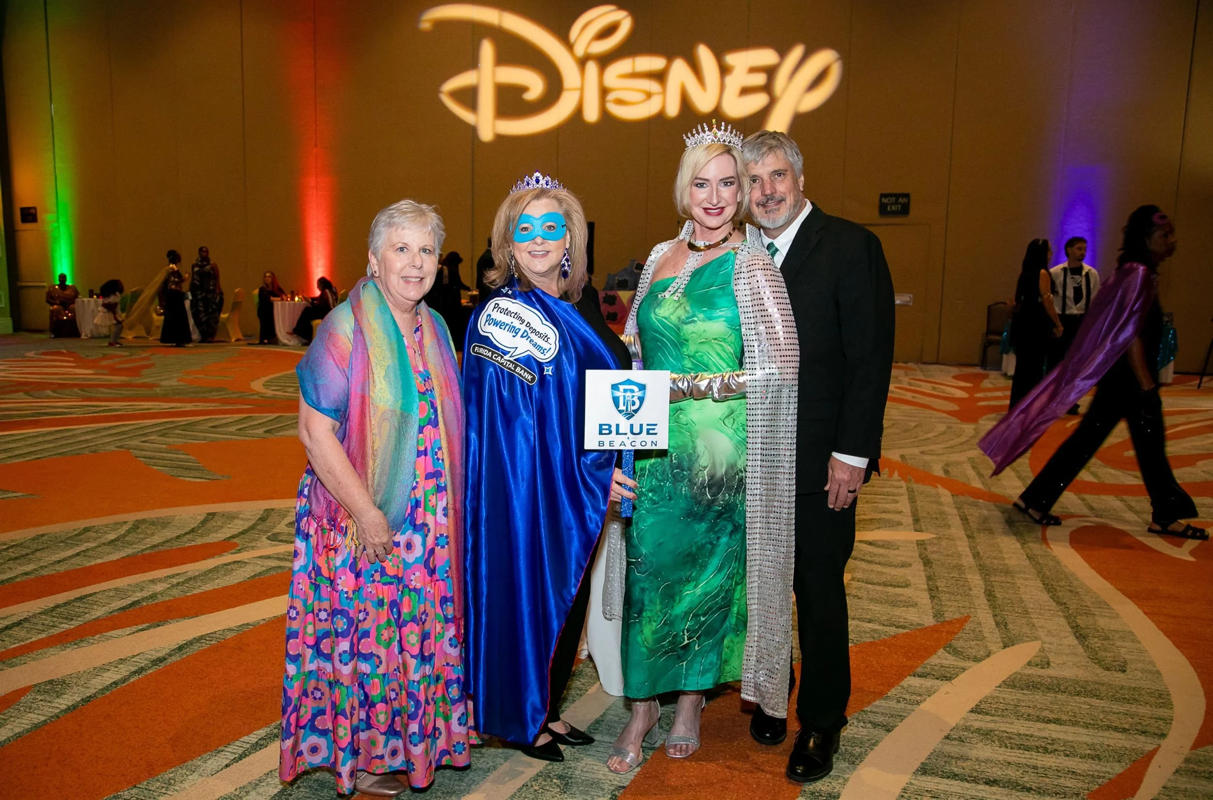 Gala attendees gathered for a group photo in front of Disney branded backdrop at the Boys & Girls Clubs of Central Florida event