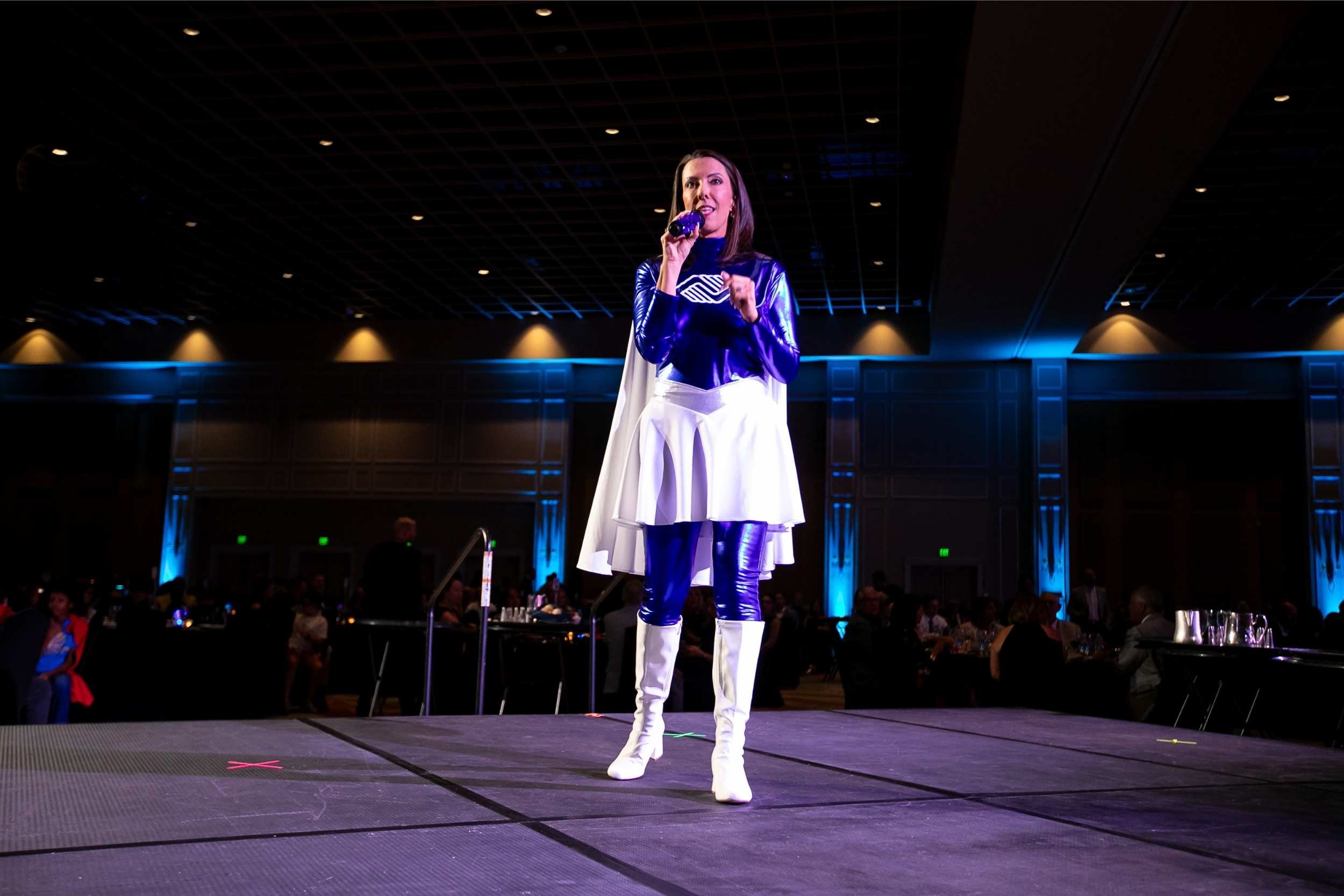 Speaker addressing guests from the stage at the Celebrate the Children gala in Orlando